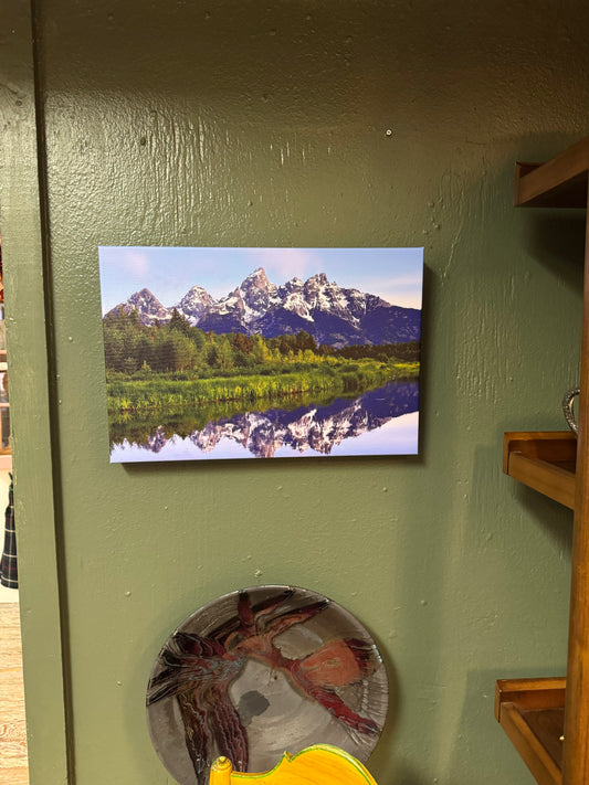Bring the grandeur of the Grand Tetons into your home with this 12×18 canvas landscape featuring snow-capped peaks reflected in a peaceful mountain pond. A timeless nature-inspired piece for cabins, living rooms, offices, and Pacific Northwest-inspired space