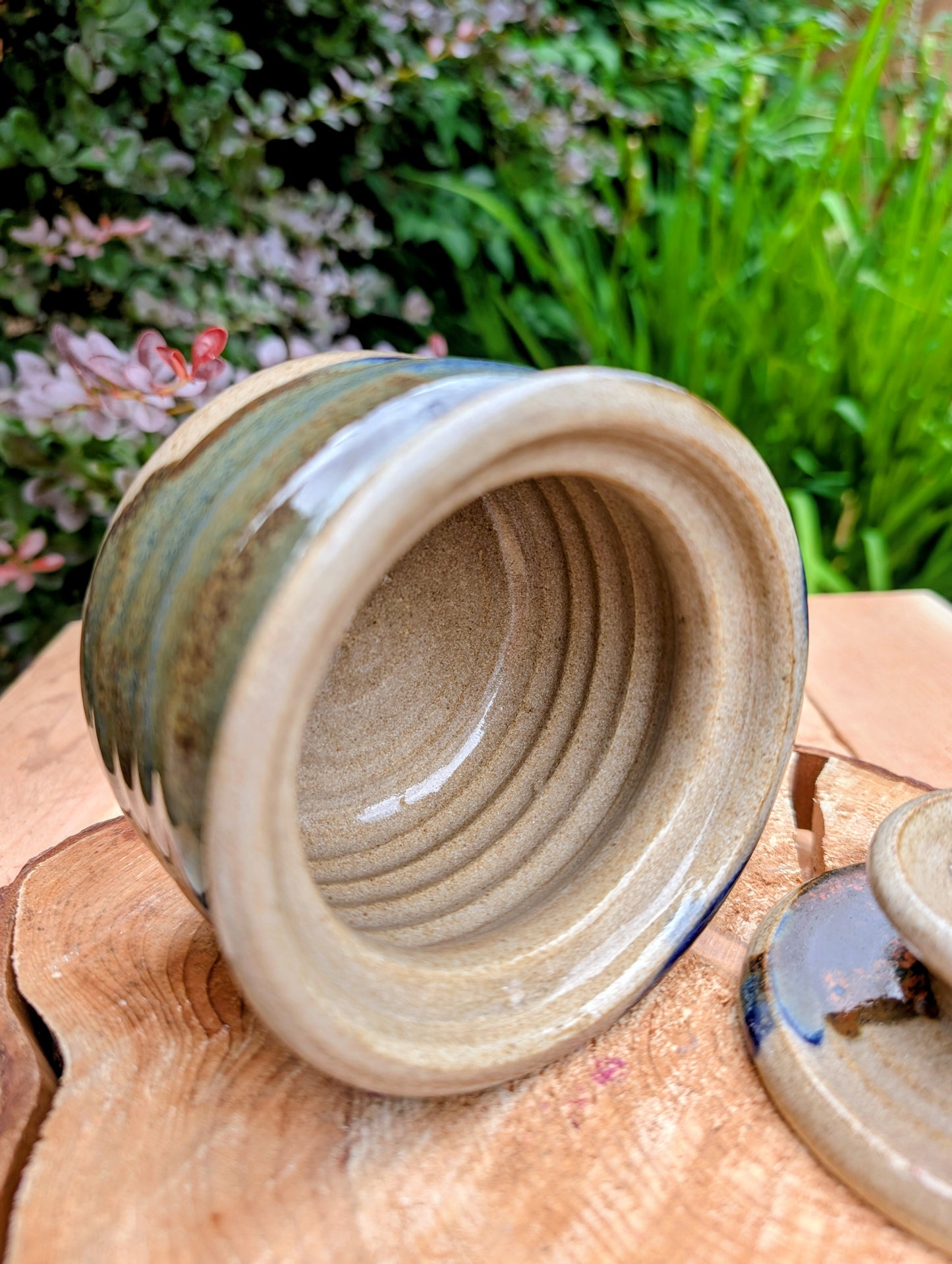 Bring handcrafted warmth to your kitchen with this signed studio pottery lidded jam pot featuring richly layered cobalt blue, olive, brown, and tan glazes. Perfect for serving honey, preserves, sugar, or favorite condiments, this artisan stoneware piece is both beautiful and functional.
