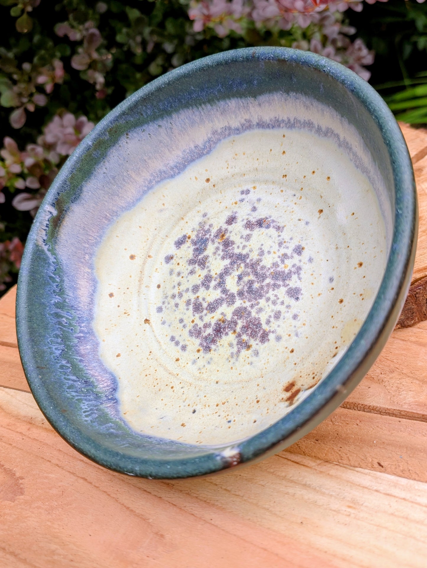 A beautifully handcrafted studio pottery bowl signed by Steve & Johnna and dated 1993. Featuring layered forest green, lavender-blue, and cream glazes, this wheel-thrown stoneware piece embodies the timeless beauty of American studio ceramics and is equally suited for everyday use or display.