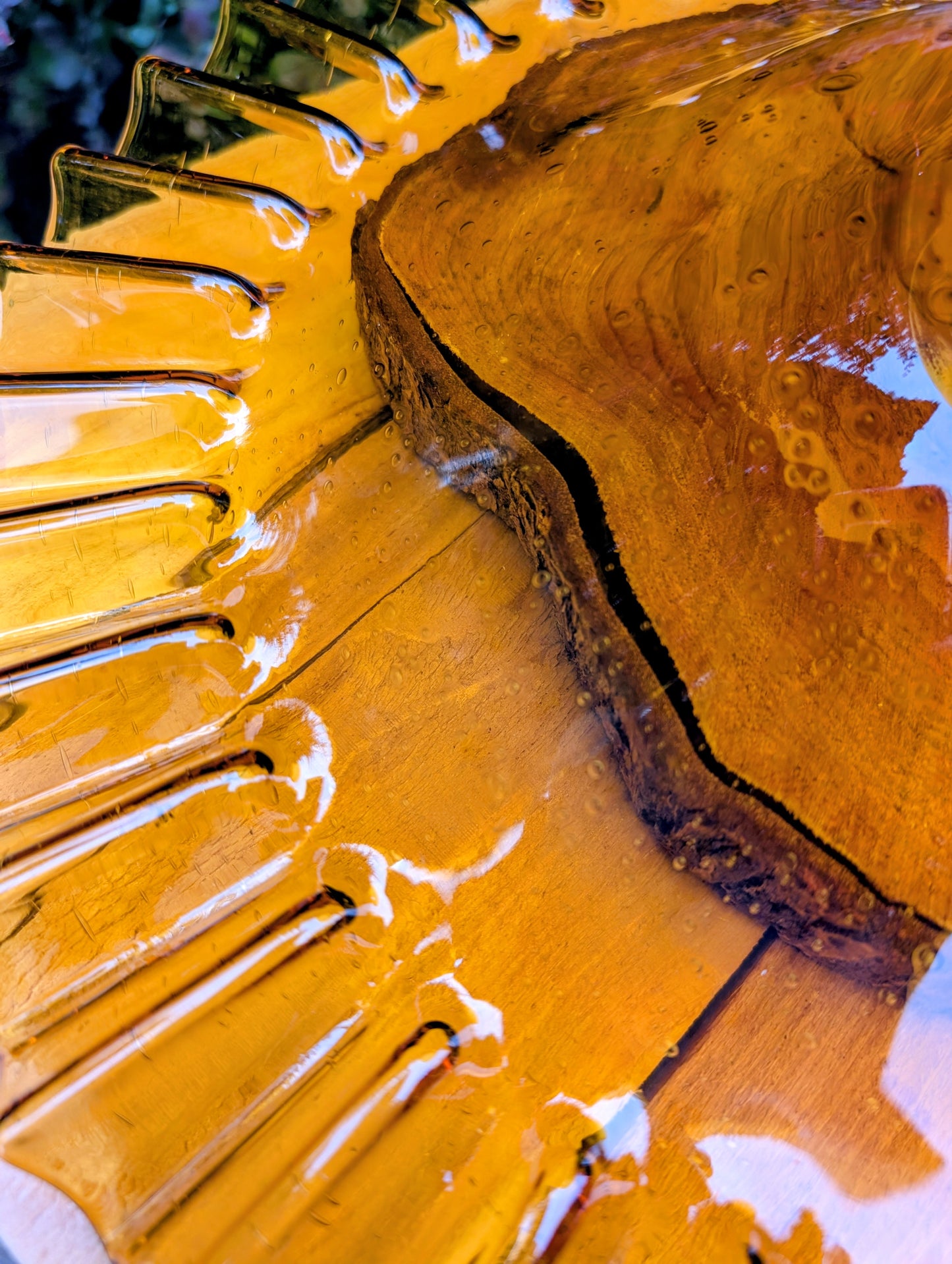 Bring warm vintage charm to your home with this large amber pressed glass pedestal console bowl, estimated to have been made by Indiana Glass during the 1960s–1970s. Its dramatic ruffled rim and generous size make it a beautiful centerpiece for seasonal displays, fruit, florals, or decorative accents throughout the year.