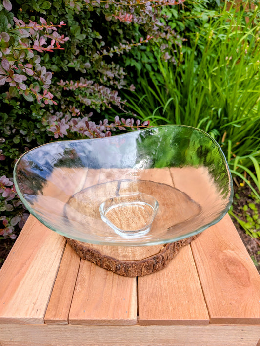 Bring sculptural elegance to your home or garden with this large freeform clear art glass bowl. Its organic silhouette, textured surface, and versatile design make it equally beautiful as a centerpiece, floating candle bowl, or decorative bird bath.