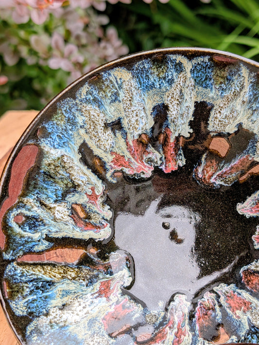 This coordinating set of two handmade studio pottery bowls showcases beautiful reactive glazes and timeless artisan craftsmanship. Perfect for serving, displaying, or gifting, the complementary designs bring warmth and organic character to any home.