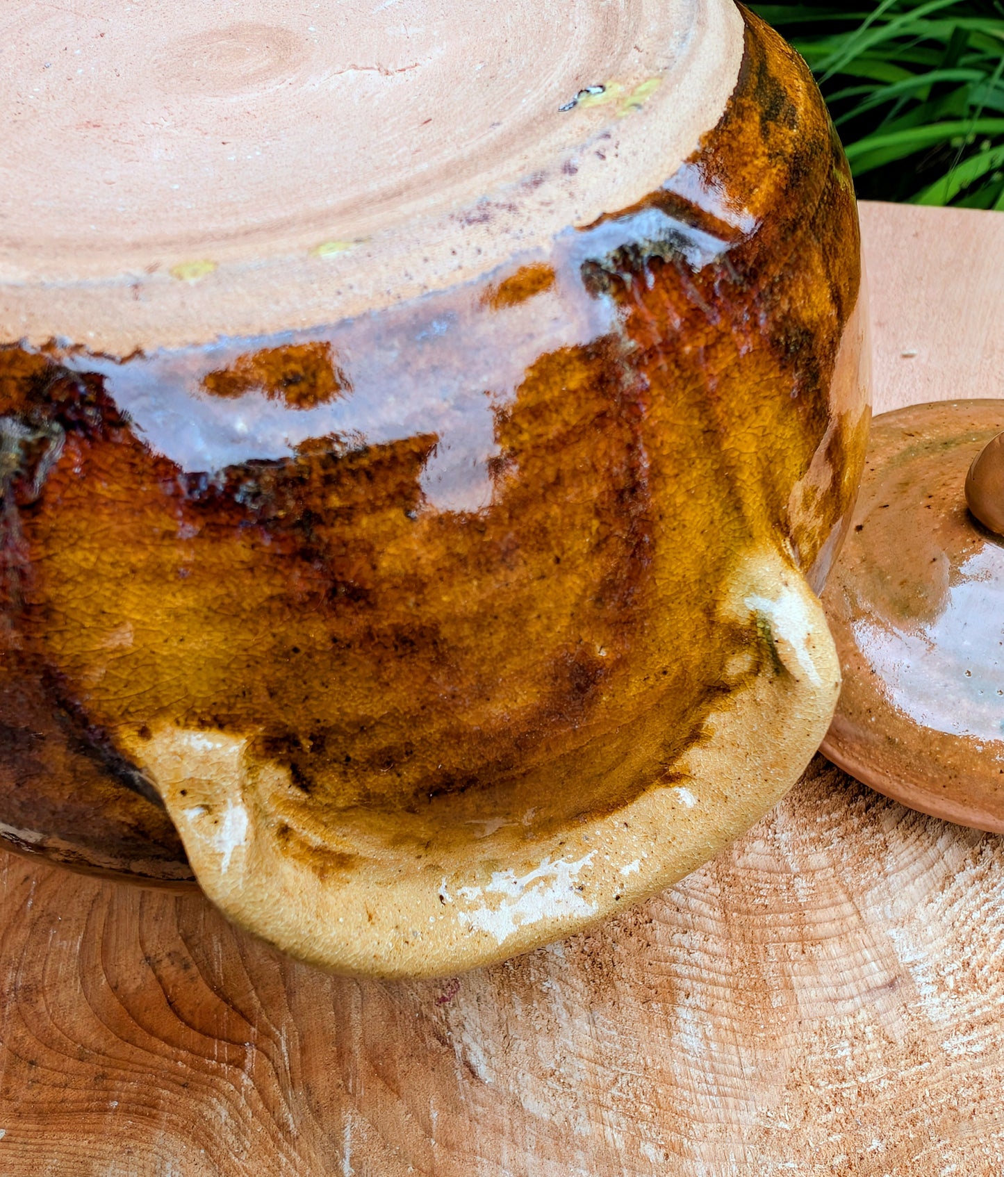 Bring timeless craftsmanship to your kitchen with this handcrafted studio pottery lidded stoneware pot. Finished in warm honey, caramel, olive, and tan glazes, this versatile covered vessel is equally beautiful as functional serveware or rustic farmhouse décor.