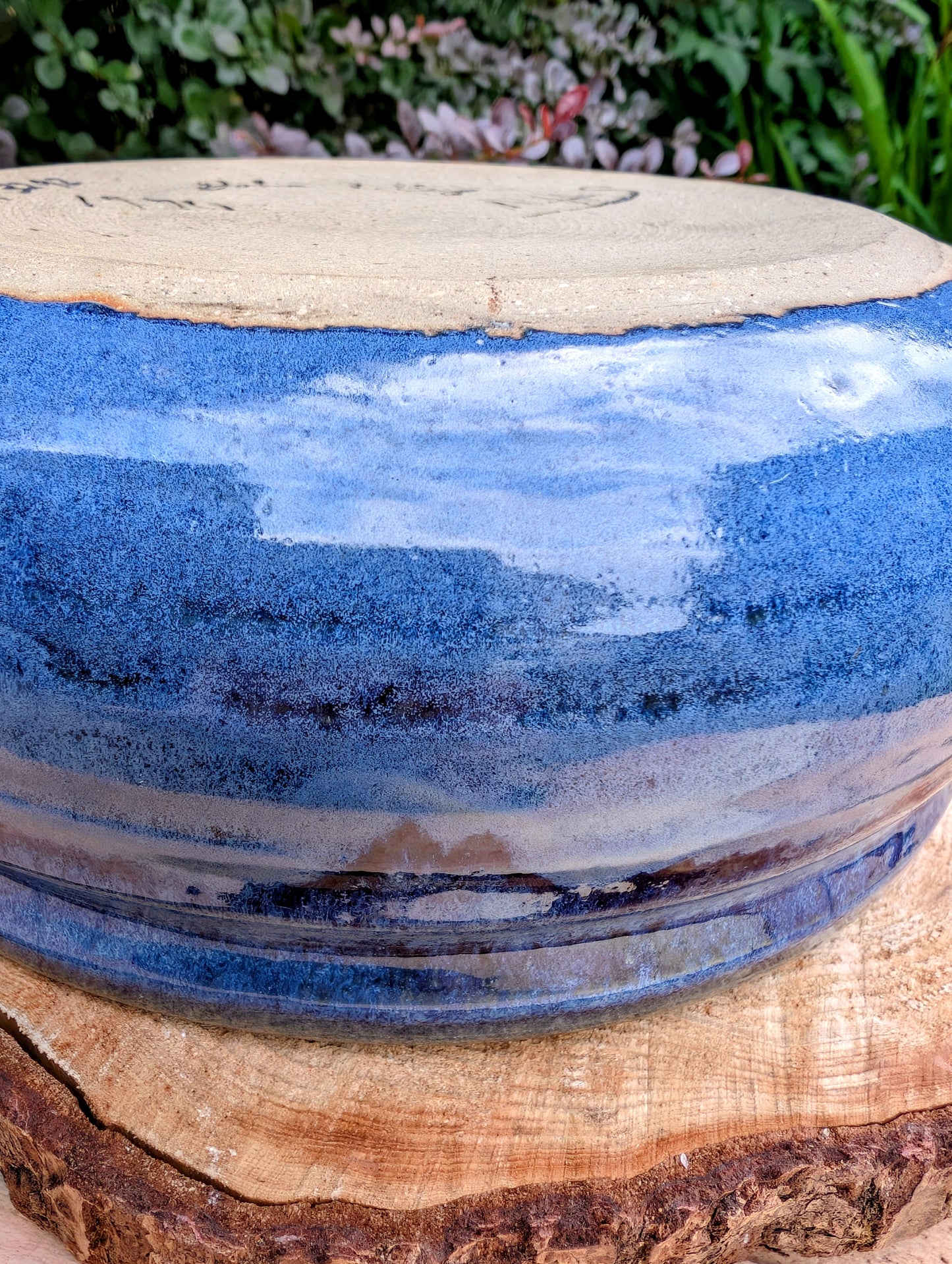 A beautifully hand-thrown studio pottery bowl dated 1990, featuring a rich satin cobalt blue glaze with a subtle spiral movement across the interior. Signed by the artist (maker currently unconfirmed), this functional stoneware piece blends everyday usefulness with timeless handcrafted artistry.