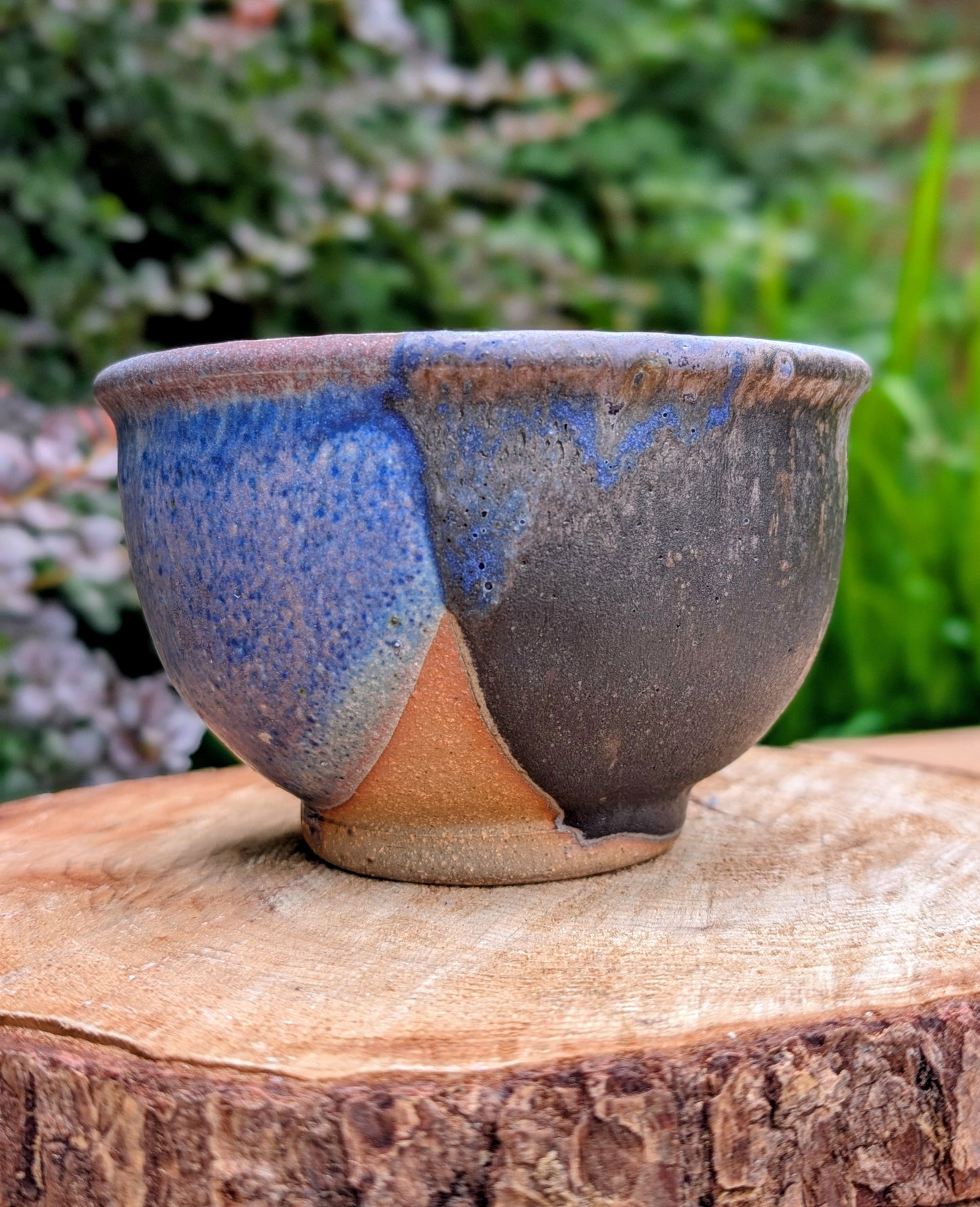 Bring handcrafted artistry to your home with this small footed studio pottery bowl featuring layered reactive glazes in purple, blue, charcoal, and earthy brown. Wheel-thrown from high-fired stoneware, its one-of-a-kind finish makes it equally beautiful as functional tableware or decorative art.