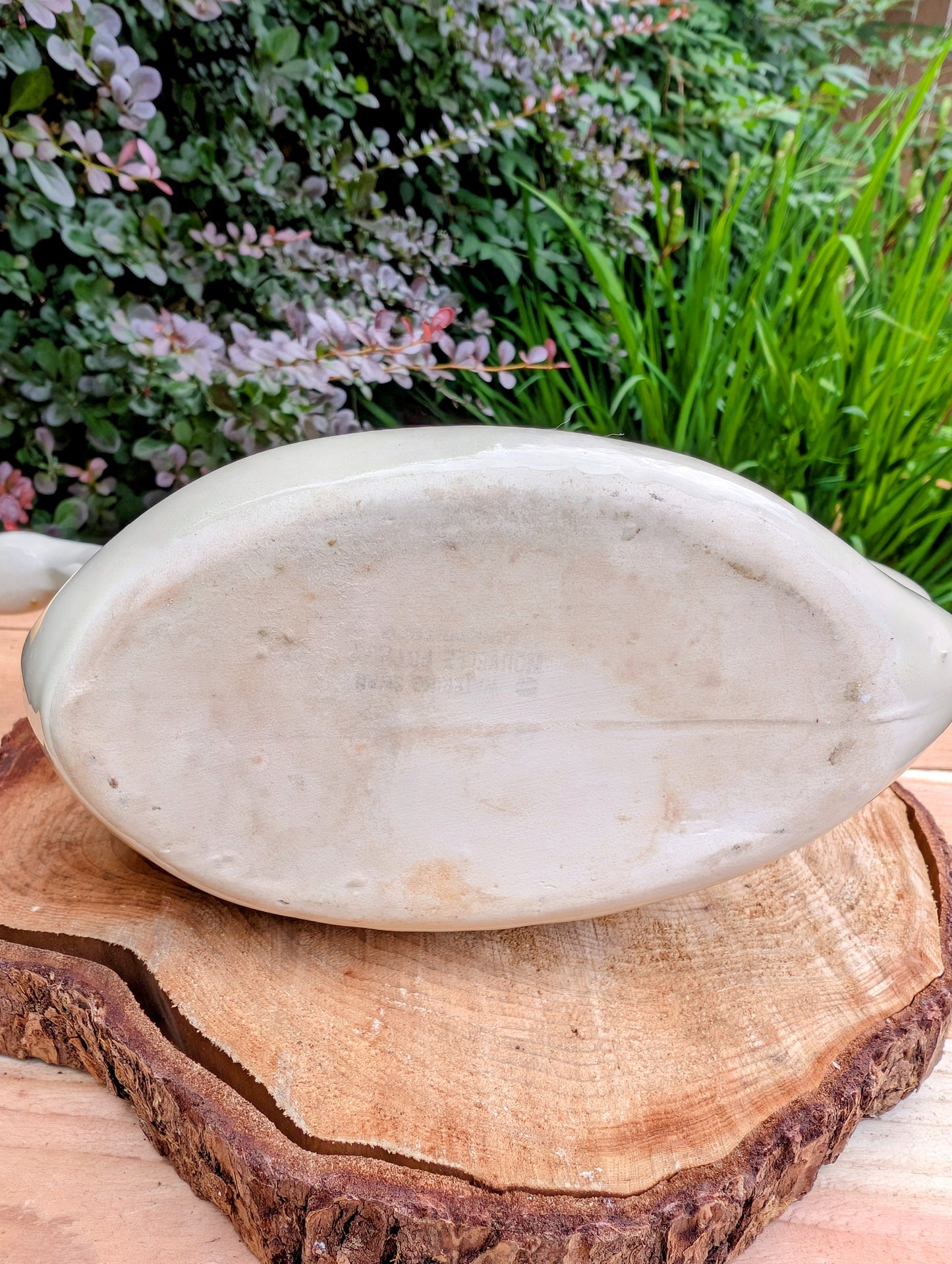 A charming 1950s Nouvelle Pottery swan watering pitcher that blends sculptural beauty with everyday function. Finished in a soft ivory glaze with hand-painted details, this Mid-Century ceramic piece is equally at home caring for houseplants or displayed as timeless vintage décor.