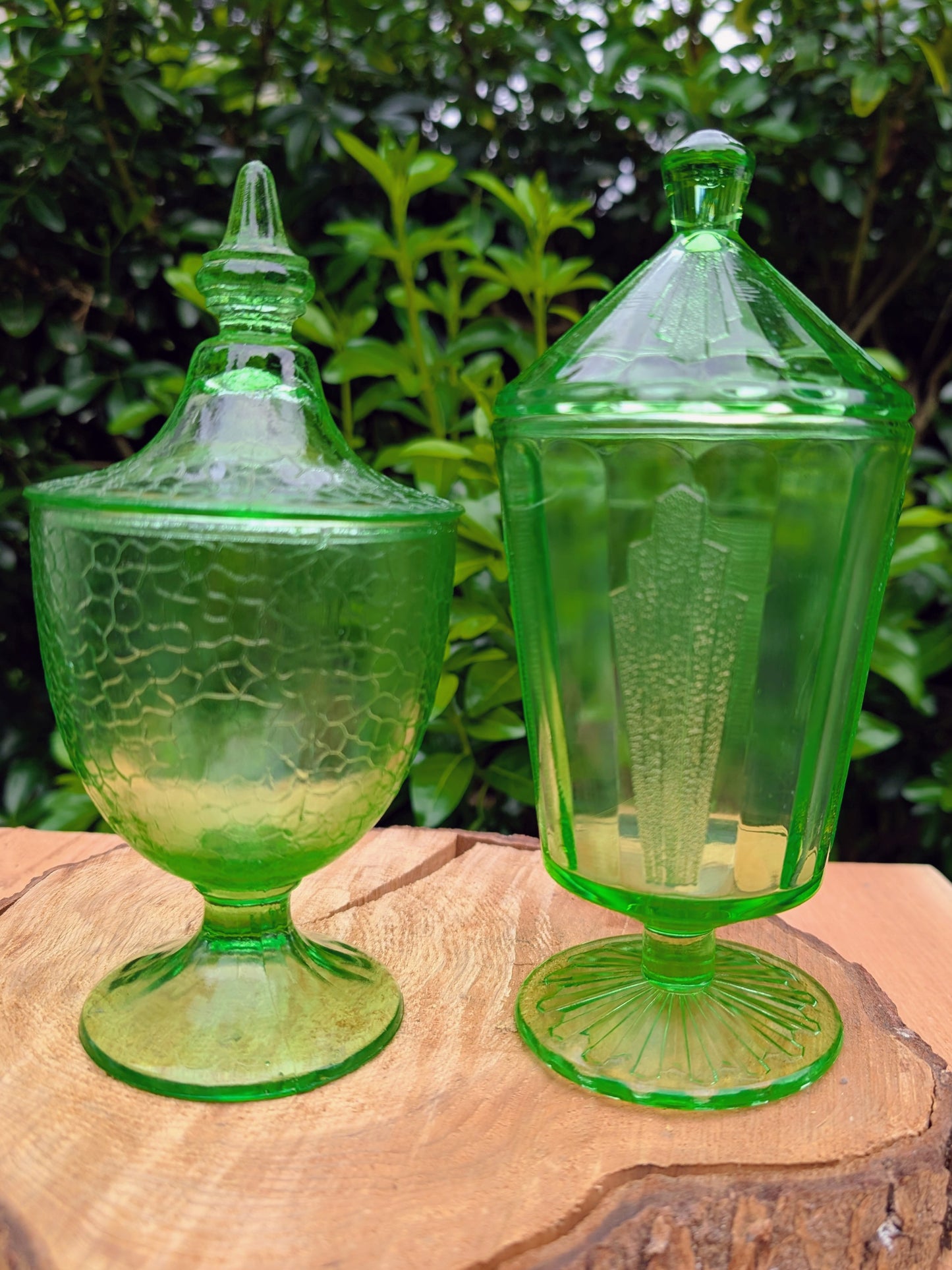 Two beautiful vintage emerald green covered pedestal candy dishes are offered in one convenient listing. Choose between a textured crackle glass design or an elegant Art Deco geometric pattern—each sold individually and carefully curated for collectors and vintage home décor enthusiasts.