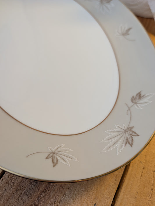 Bring timeless elegance to your garden with this repurposed vintage Zylstra Select Fine China serving platter. Featuring the delicate Frosted Leaves pattern with gold trim, this one-of-a-kind bird feeding platter blends mid-century craftsmanship with sustainable outdoor living.