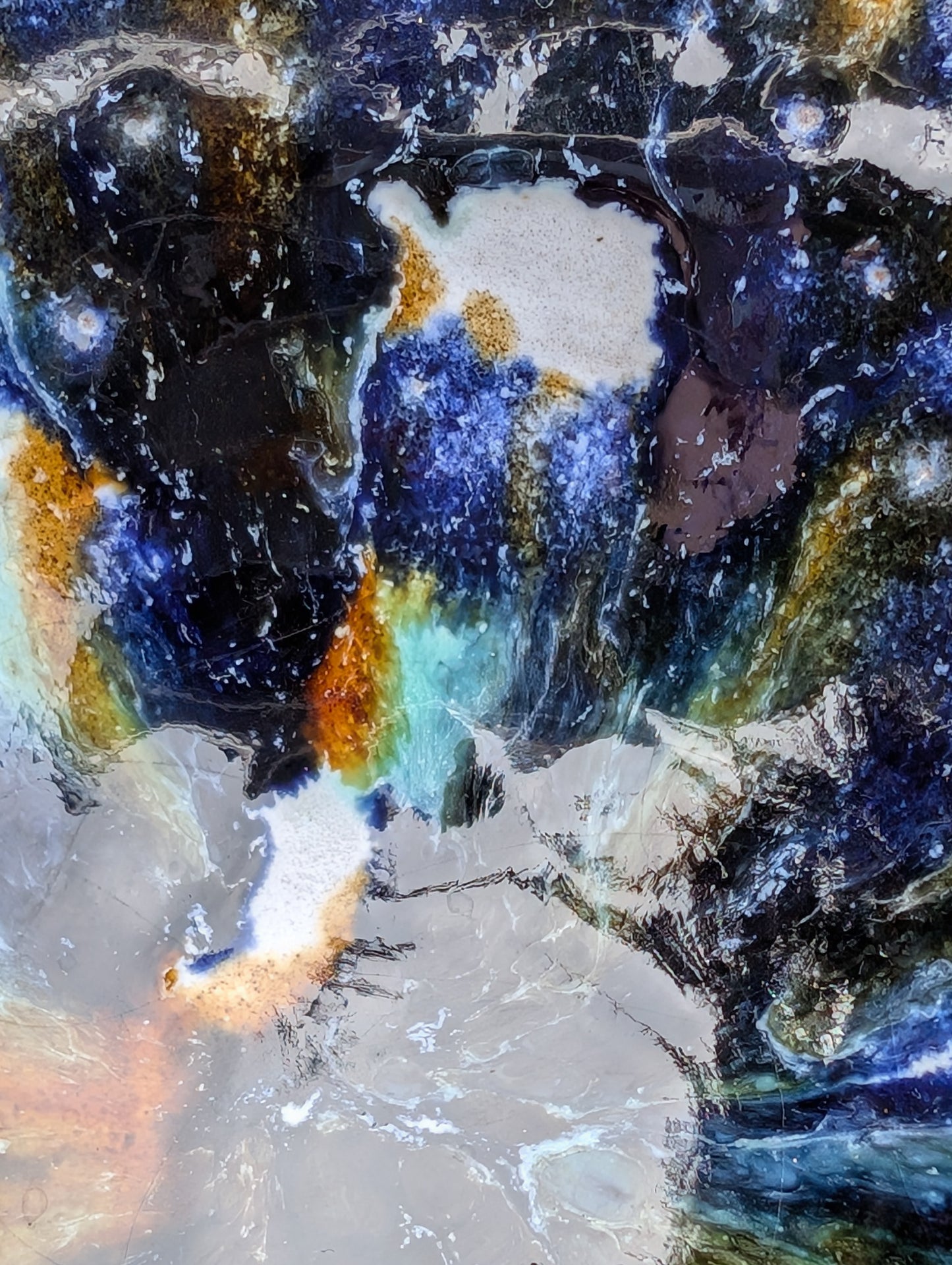 Bring handcrafted artistry to your table with this matching pair of signed studio pottery bowls. Finished with richly layered reactive glazes in cobalt blue, teal, amber, and ivory, these versatile artisan bowls are equally beautiful for entertaining or everyday display.