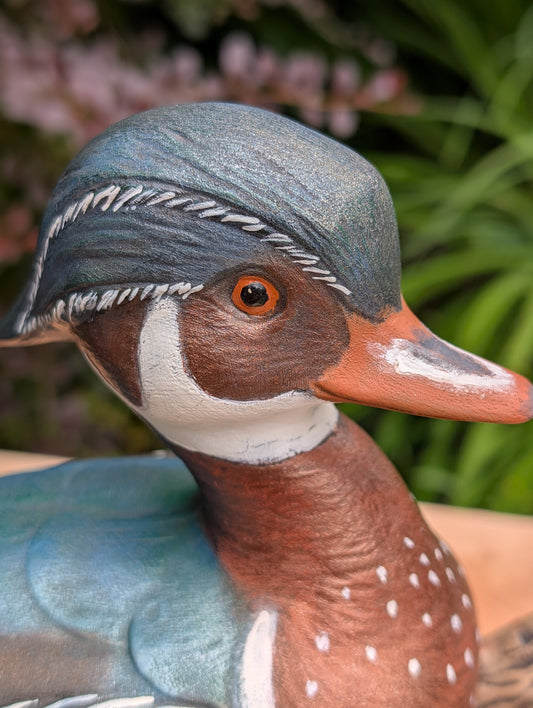 Celebrate the beauty of North American wetlands with this hand-painted ceramic Wood Duck sculpture, dated 1969 and mounted on a sculpted faux driftwood log. Richly detailed and full of rustic charm, it makes a wonderful addition to lodge, cabin, or nature-inspired décor.