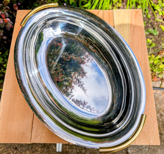 Give backyard birds an elegant place to gather with this thoughtfully repurposed vintage Italian serving tray. Crafted from premium 18/10 stainless steel with warm brass-plated handles, it blends timeless design with practical durability for year-round garden enjoyment.