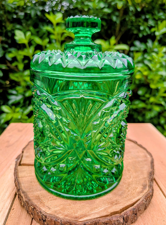 A brilliant Mid-Century collectible crafted in rich emerald pressed glass featuring Imperial's iconic Hobstar pattern.
