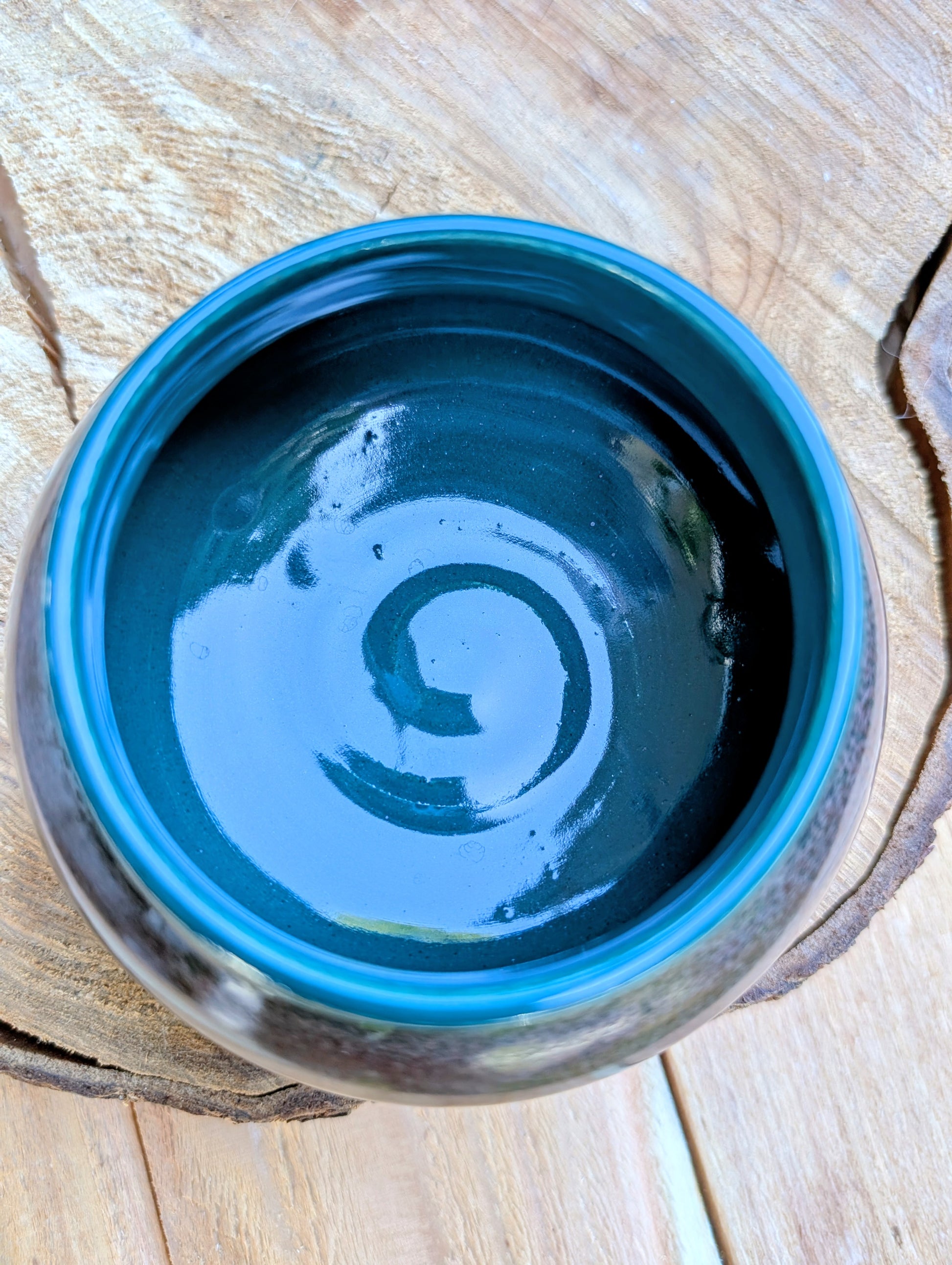 Blue ceramic bowl on a wooden surface