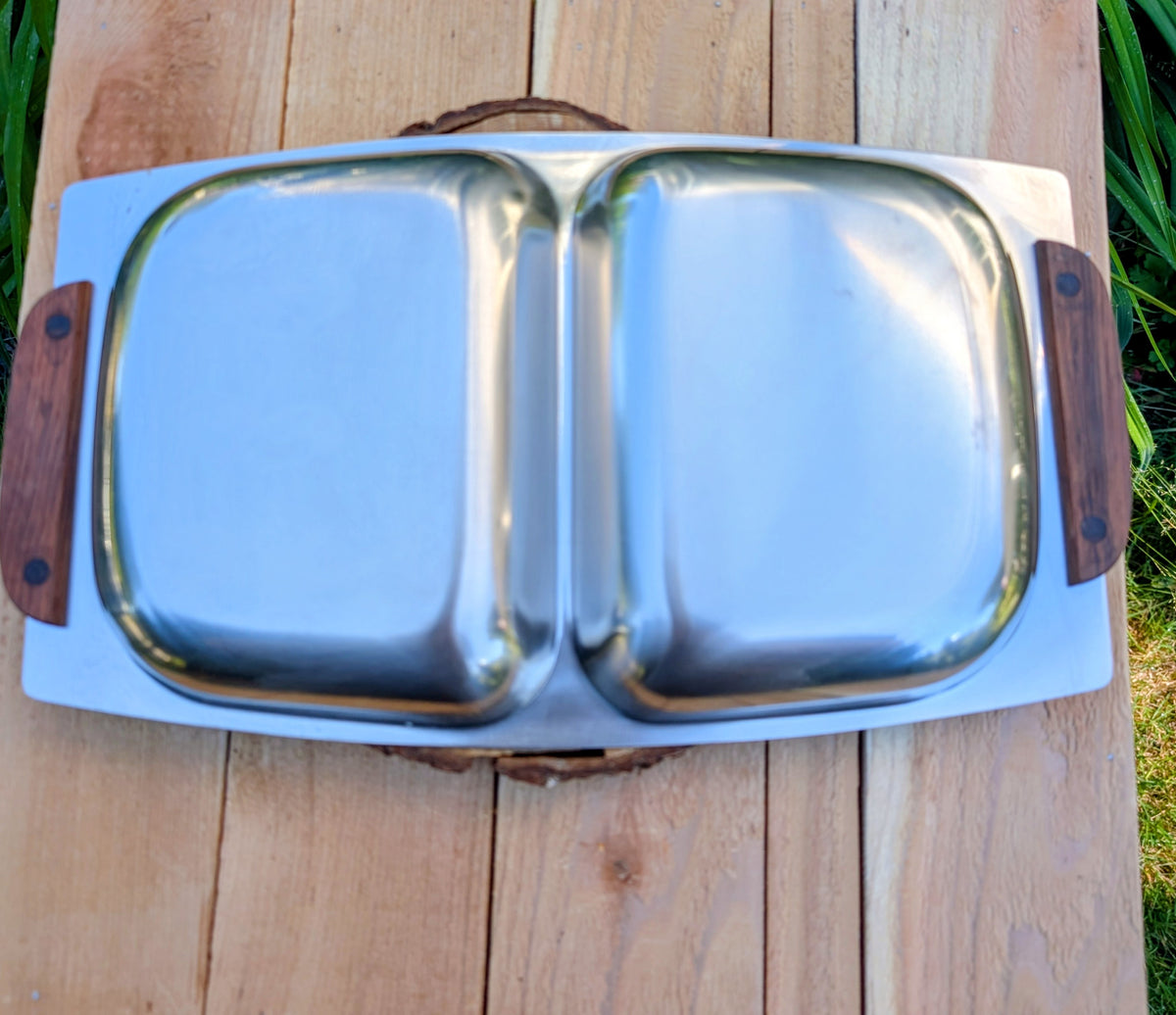 Invite a greater variety of backyard birds to your garden with this repurposed vintage stainless steel divided serving tray. Featuring two feeding compartments and warm wood handles, this one-of-a-kind piece combines timeless vintage style with practical bird-friendly function.