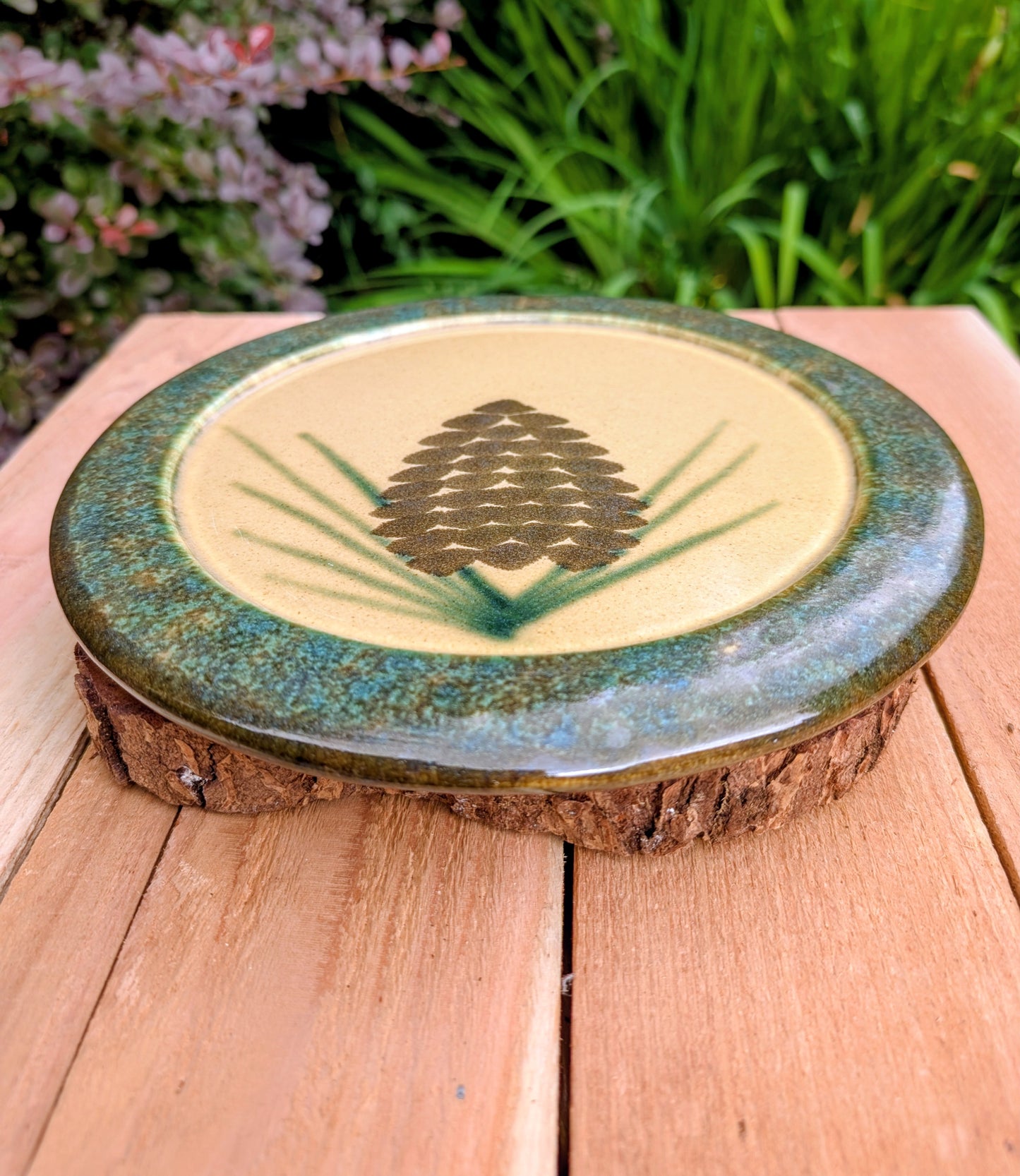 Bring the warmth of the forest to your table with this handcrafted Monroe Salt Works Pine Cone dinner plate. Featuring a classic salt-glazed finish and timeless woodland motif, this beautifully made stoneware piece blends everyday function with rustic New England craftsmanship.