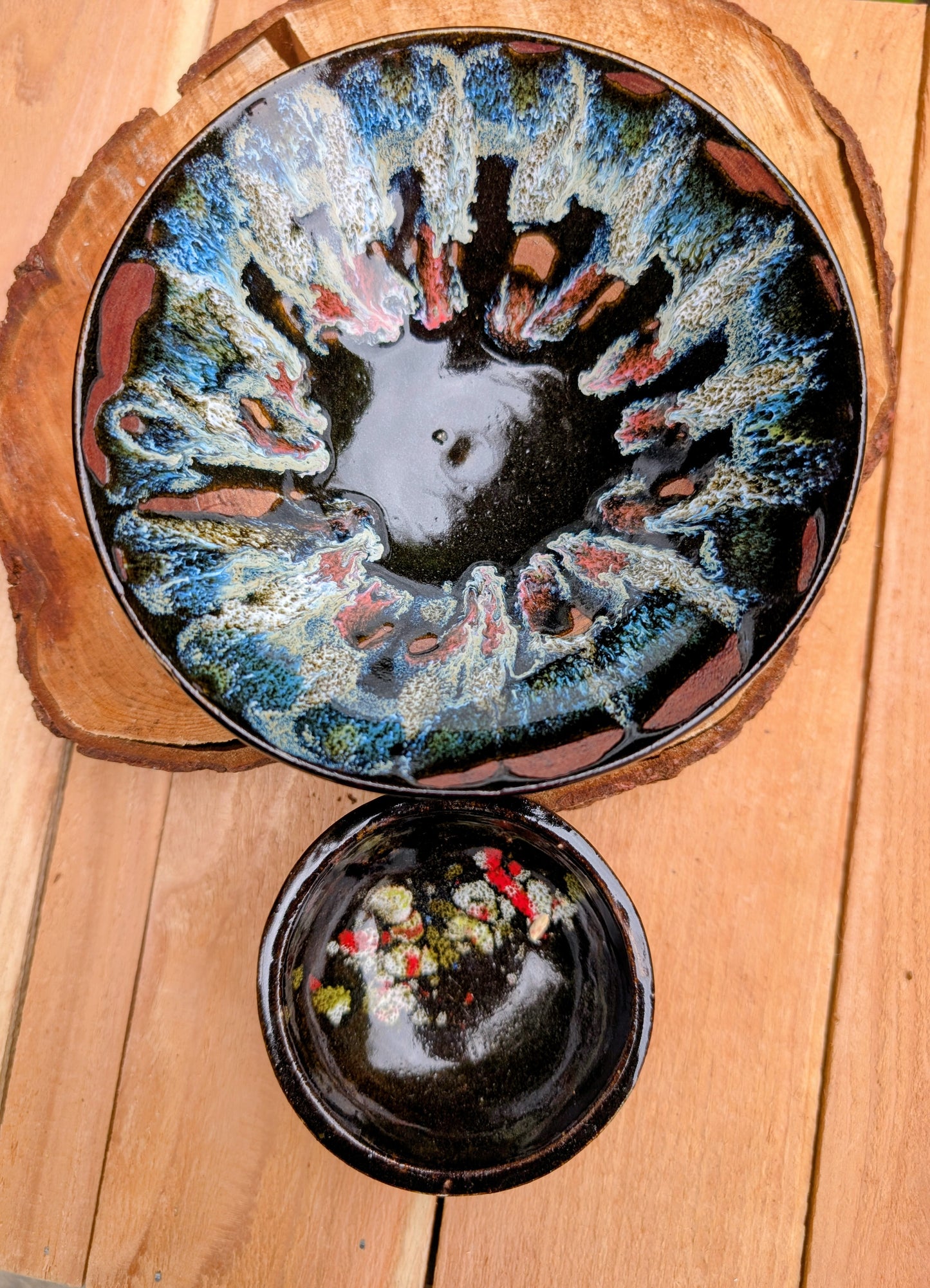 This coordinating set of two handmade studio pottery bowls showcases beautiful reactive glazes and timeless artisan craftsmanship. Perfect for serving, displaying, or gifting, the complementary designs bring warmth and organic character to any home.