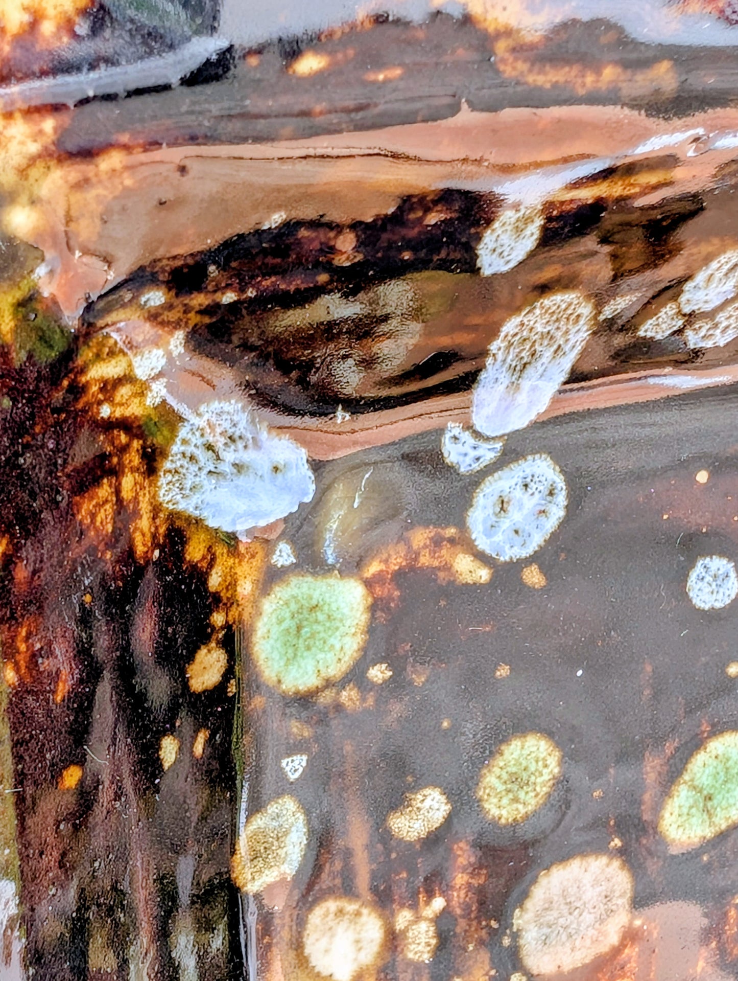 Bring handcrafted artistry into your home with this one-of-a-kind square studio pottery dish. Its rich chocolate brown glaze is accented by constellation-like blue, green, and cream crystalline details, making it equally beautiful as a decorative catchall, appetizer dish, or display piece.