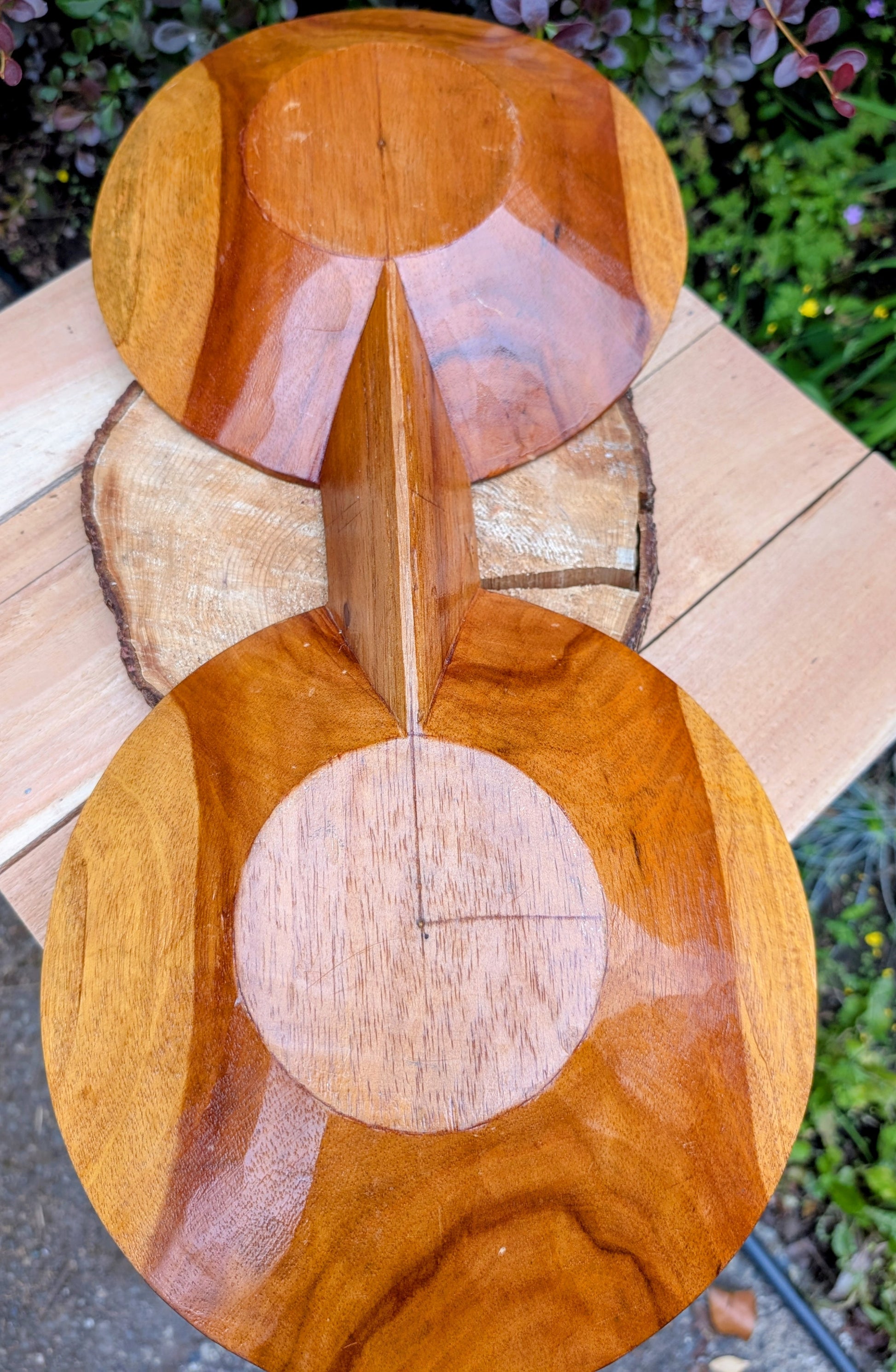 Serve with timeless style using this hand-carved Monkey Pod wood double serving tray. Crafted from a single piece of richly grained hardwood, its sculptural silhouette makes it equally beautiful as a serving piece or decorative centerpiece.