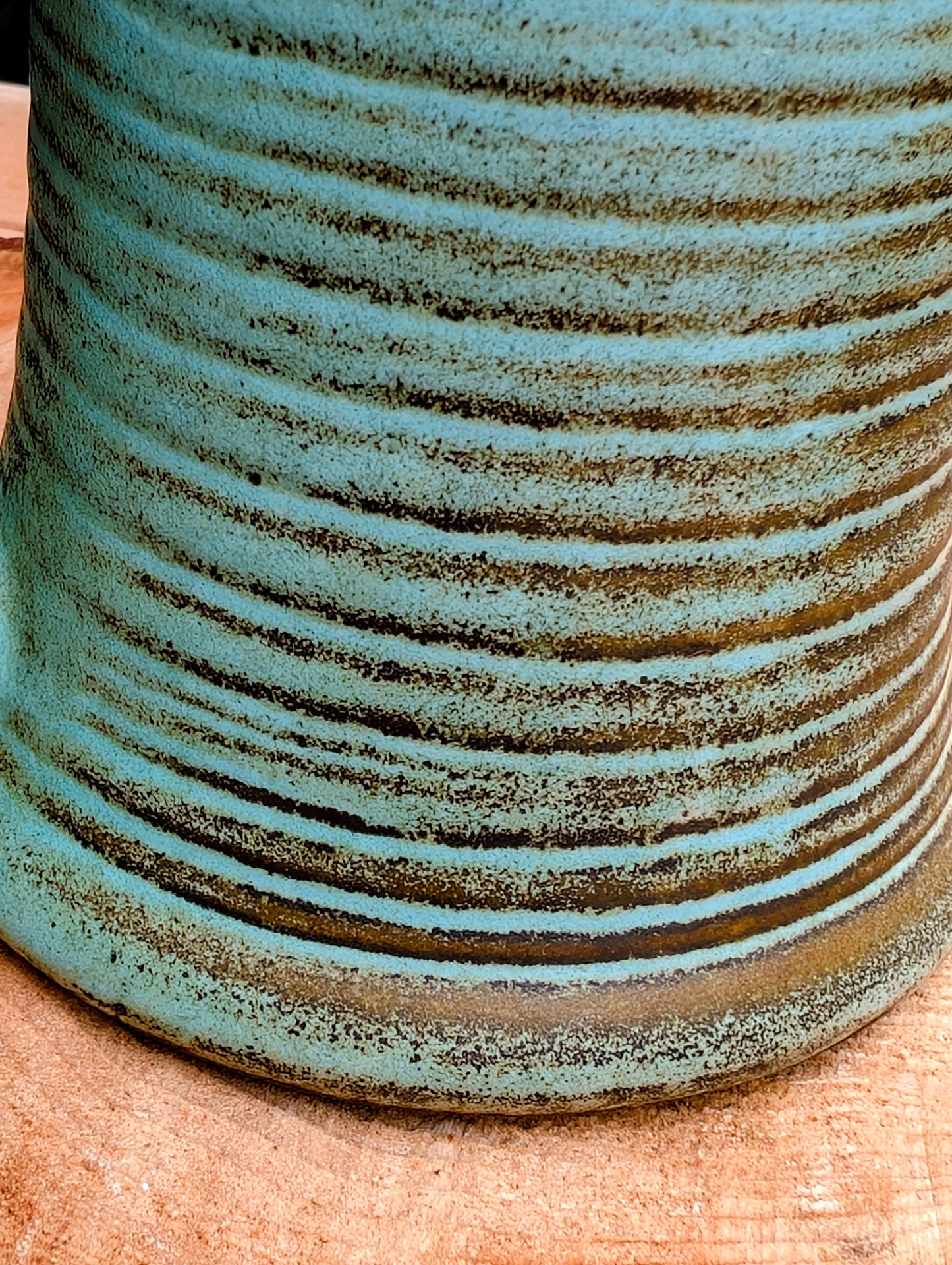 A beautifully handcrafted studio pottery tankard-style mug, wheel-thrown in Hot Springs, Arkansas and dated 2007. Its flowing turquoise, olive, and bronze glaze, generous size, and comfortable thumb-rest handle make it both a functional everyday piece and a collectible example of American studio pottery.