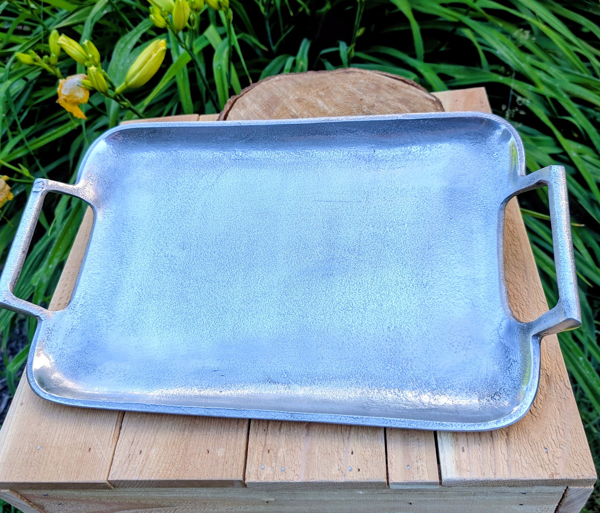 Bring timeless elegance to your garden or home with this vintage cast aluminum serving tray featuring a beautiful satin pewter finish and integrated handles. Originally designed for entertaining, it has been thoughtfully curated by Cedar & Song Studio as a versatile bird feeding tray, centerpiece, or decorative serving piece.