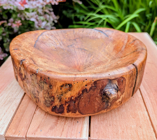 Celebrate craftsmanship and Pacific Northwest heritage with this one-of-a-kind hand-carved live edge wooden bowl. Originally commissioned as the 2013 Men's Overall Sprint Duathlon award for the Oregon Dunes Triathlon & Duathlon, it blends sculptural beauty with authentic regional history.
