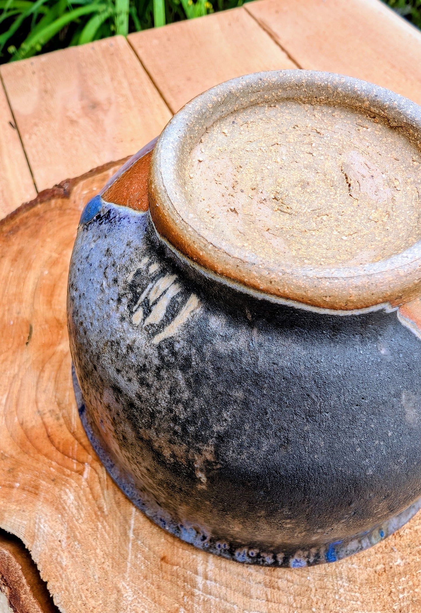 Bring handcrafted artistry to your home with this small footed studio pottery bowl featuring layered reactive glazes in purple, blue, charcoal, and earthy brown. Wheel-thrown from high-fired stoneware, its one-of-a-kind finish makes it equally beautiful as functional tableware or decorative art.