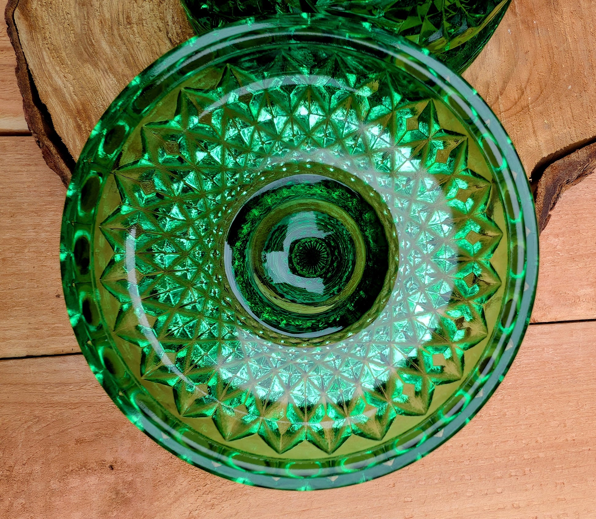A brilliant Mid-Century collectible crafted in rich emerald pressed glass featuring Imperial's iconic Hobstar pattern.