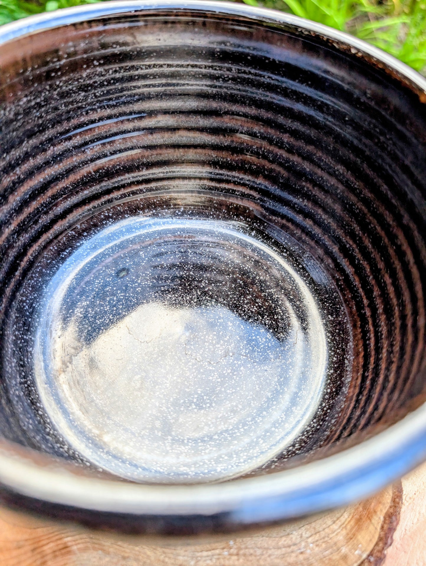 Bring the warmth of Pacific Northwest craftsmanship to your home with this authentic Bruning Pottery stoneware bowl from the studio's Seattle era. Featuring a rich iron-speckled glaze and wheel-thrown construction, it's equally beautiful as a serving bowl, planter cachepot, or decorative display piece.