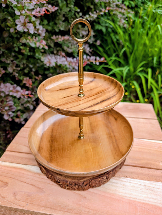 Bring a touch of the Pacific Northwest to your table with this authentic Duncan's Oregon Myrtlewood two-tier serving stand. Crafted from rare Oregon myrtlewood with a warm honey finish and elegant brass hardware, it's equally beautiful for entertaining or everyday display.