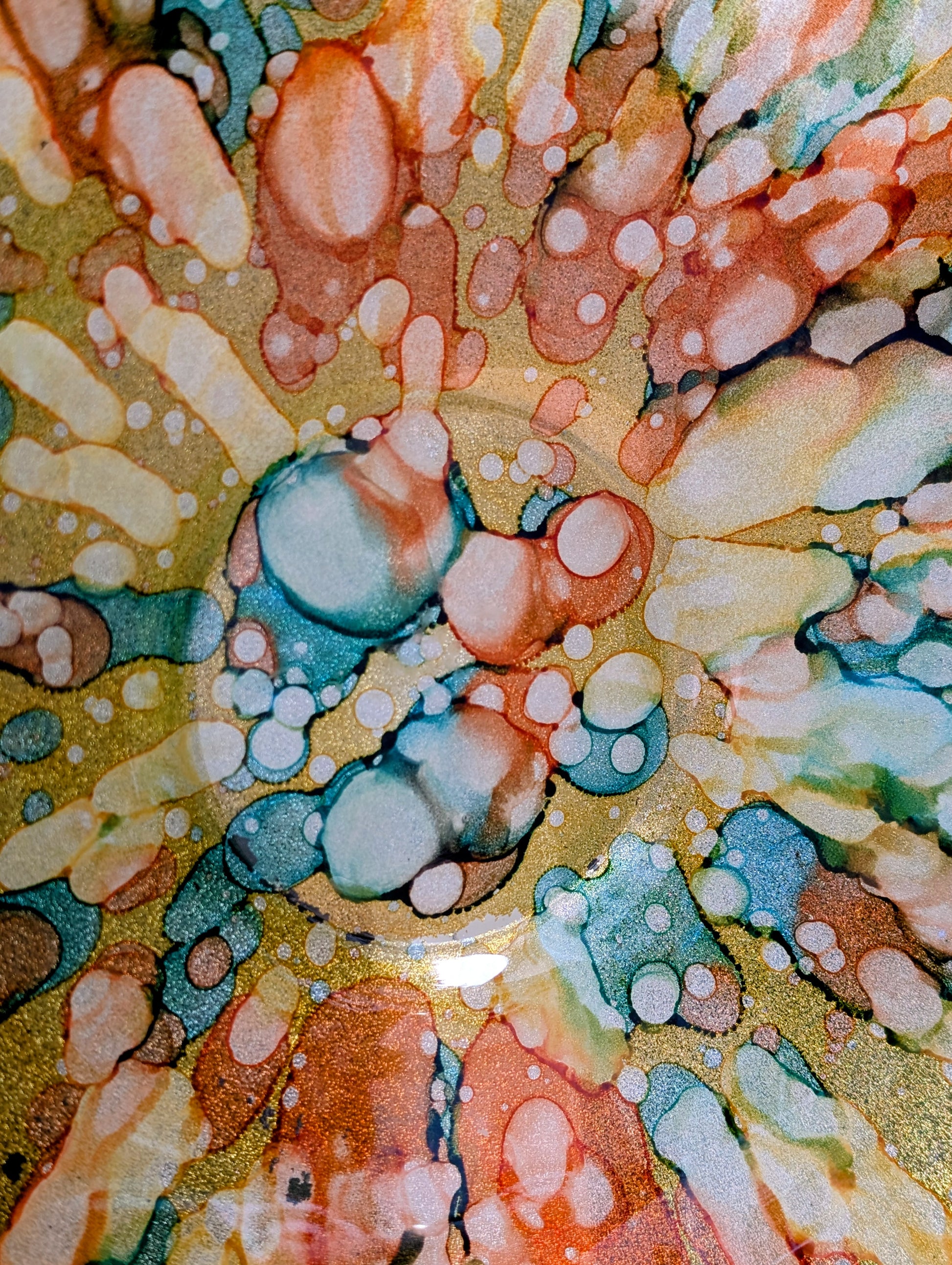 Bring color and light to your home or garden with this contemporary scalloped art glass bowl. Featuring warm golden tones accented by olive green, amber, turquoise, and shimmering metallic highlights, it serves beautifully as a centerpiece, decorative bowl, or tabletop bird bath.