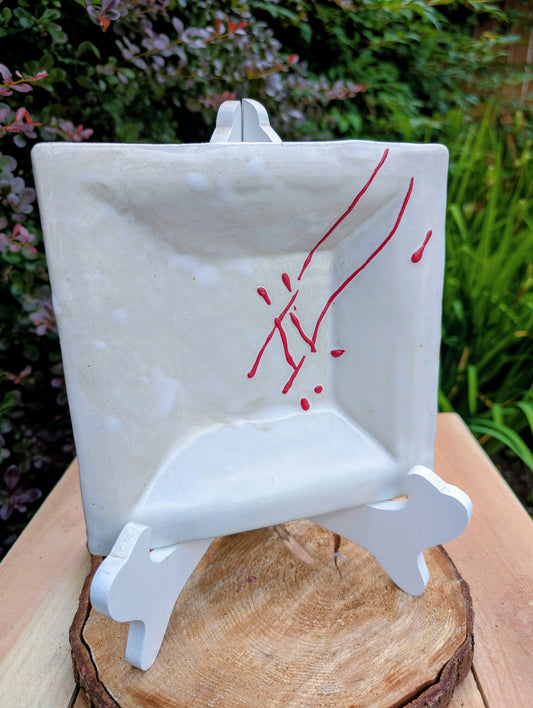Bring handcrafted artistry into your home with this unsigned studio pottery catchall dish featuring a sculptural folded-corner design and expressive red slip decoration. Beautiful as both functional pottery and contemporary décor, it offers timeless Pacific Northwest style with organic modern appeal.