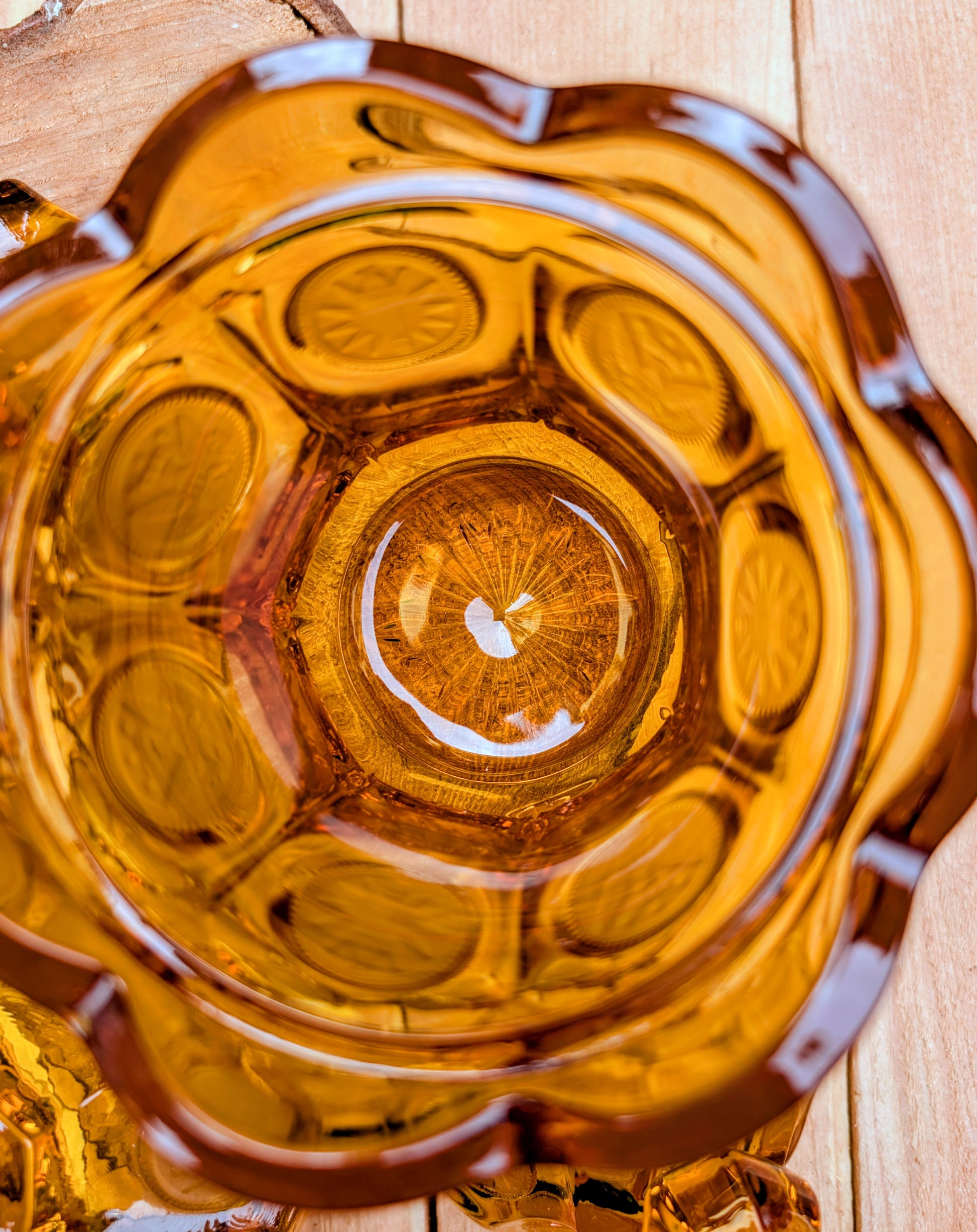 A stunning matching set of vintage Indiana Glass in the iconic Kings Crown (Coin) pattern. This coordinated amber glass collection includes a covered pedestal vase and matching covered candy dish, each with its original lid. A beautiful Mid-Century display for collectors and vintage home décor enthusiasts.