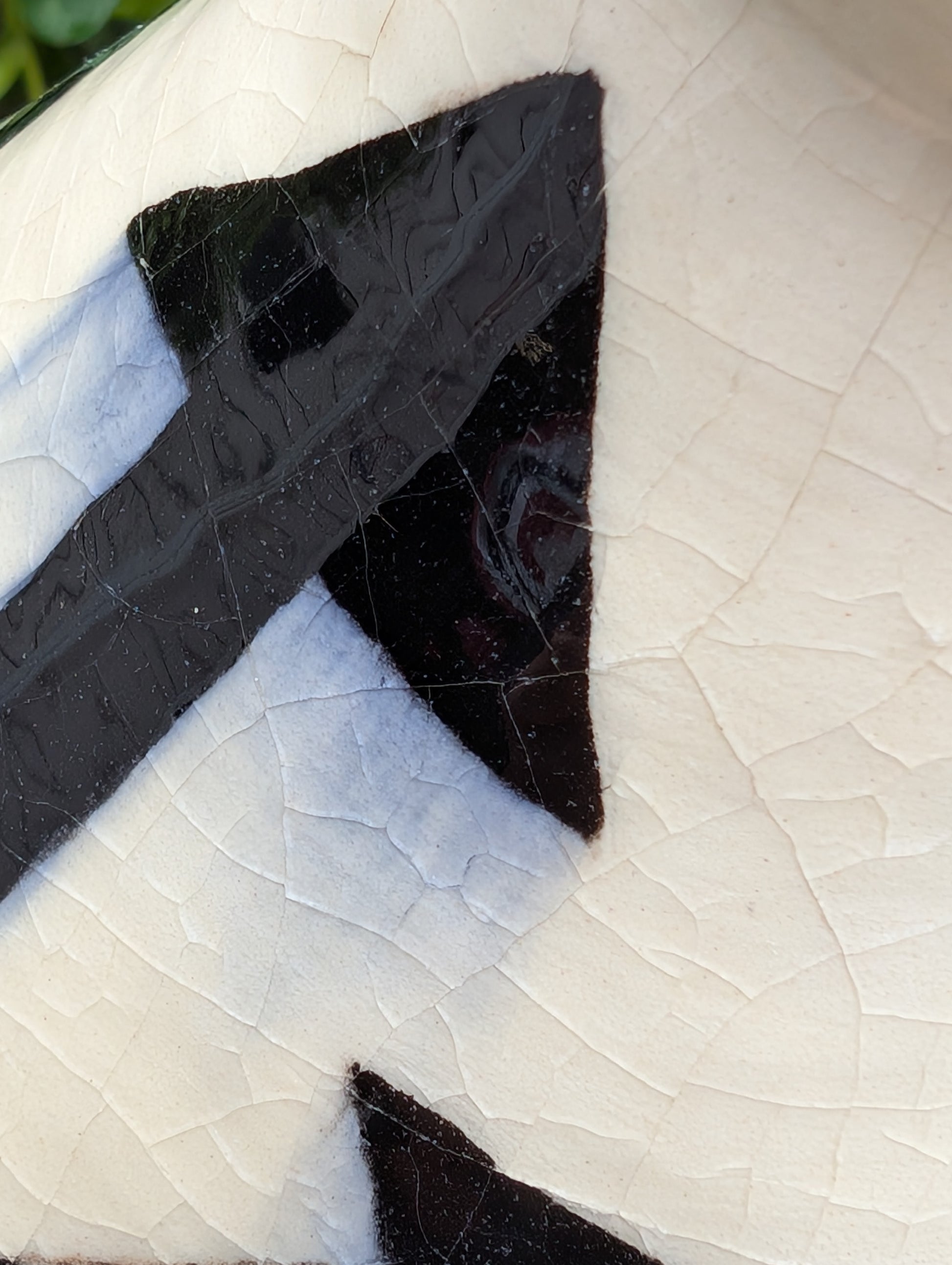 A striking signed studio pottery vase created by Sarah Palman in 1995, featuring bold black abstract arrow motifs over an ivory crackle glaze. This handcrafted ceramic sculpture blends modern design with timeless craftsmanship, making it equally beautiful displayed alone or with dried botanicals.