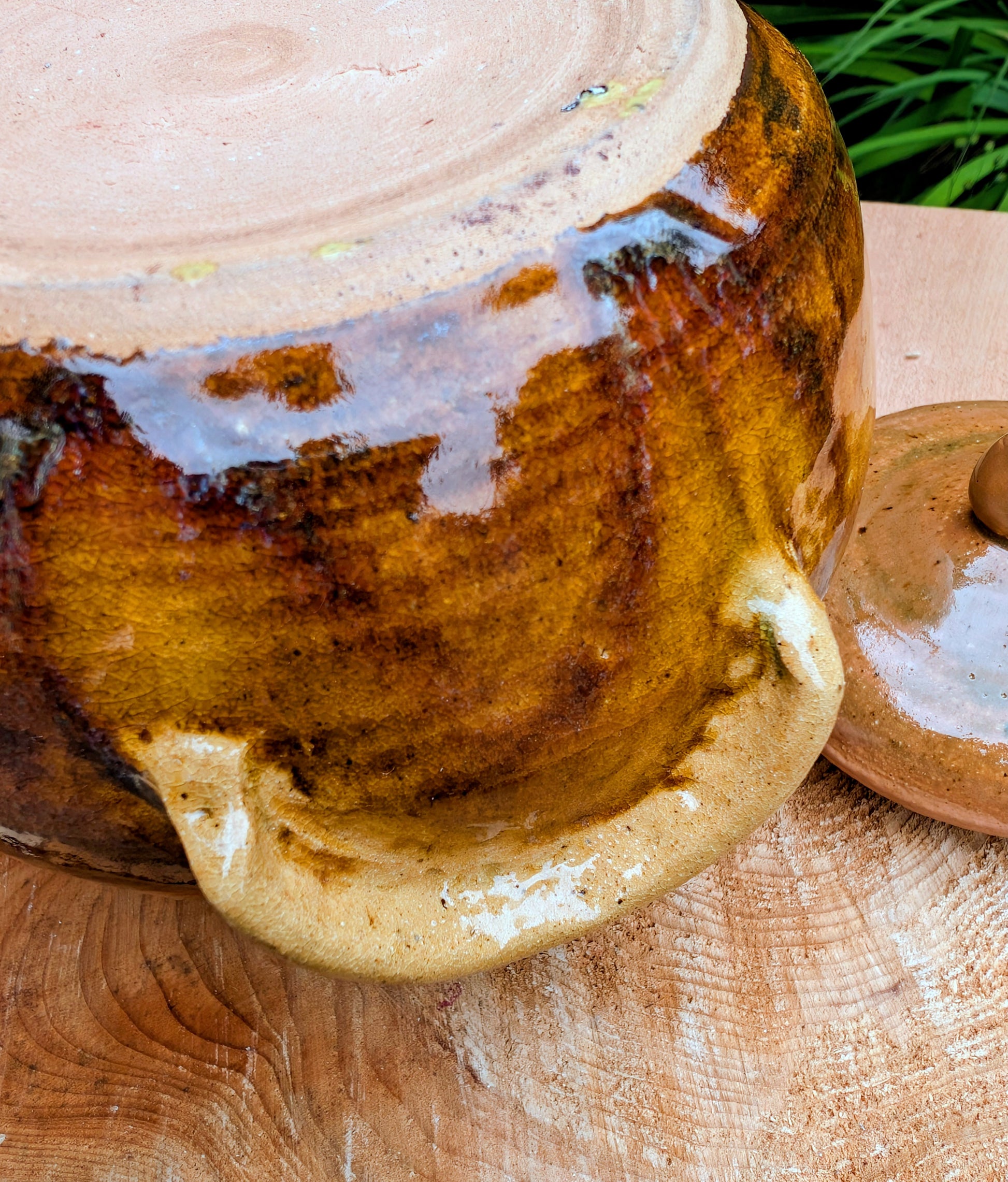 Bring timeless craftsmanship to your kitchen with this handcrafted studio pottery lidded stoneware pot. Finished in warm honey, caramel, olive, and tan glazes, this versatile covered vessel is equally beautiful as functional serveware or rustic farmhouse décor.