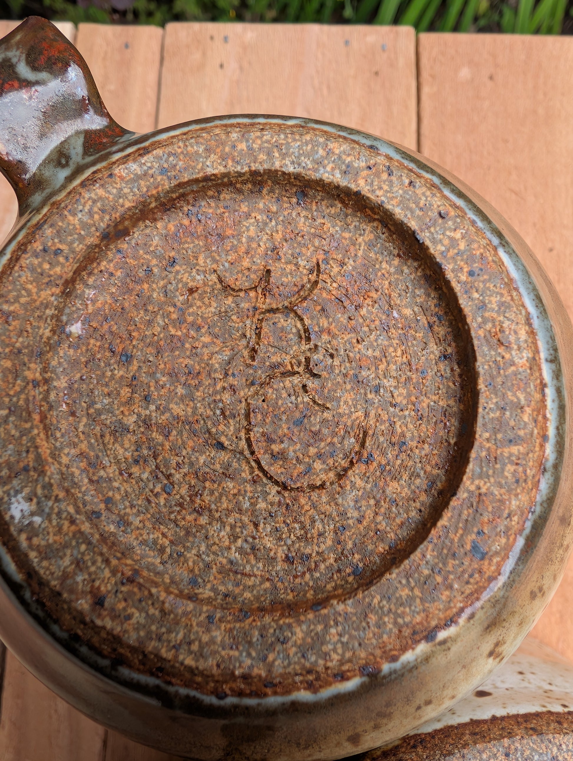 Bring handcrafted warmth to your table with this signed studio pottery creamer and sugar bowl set. Finished in a beautiful speckled cream glaze with flowing olive-brown accents, this artisan stoneware pair blends rustic craftsmanship with timeless everyday function.