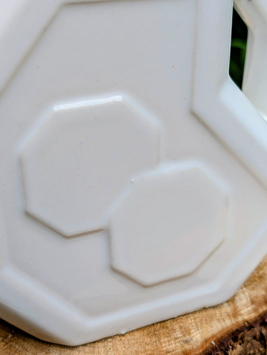 Bring timeless American Art Deco design into your home with this vintage Alamo Pottery Shape No. 758 pitcher. Its crisp geometric silhouette and glossy white glaze make it equally beautiful as a functional pitcher, sculptural vase, or decorative accent.