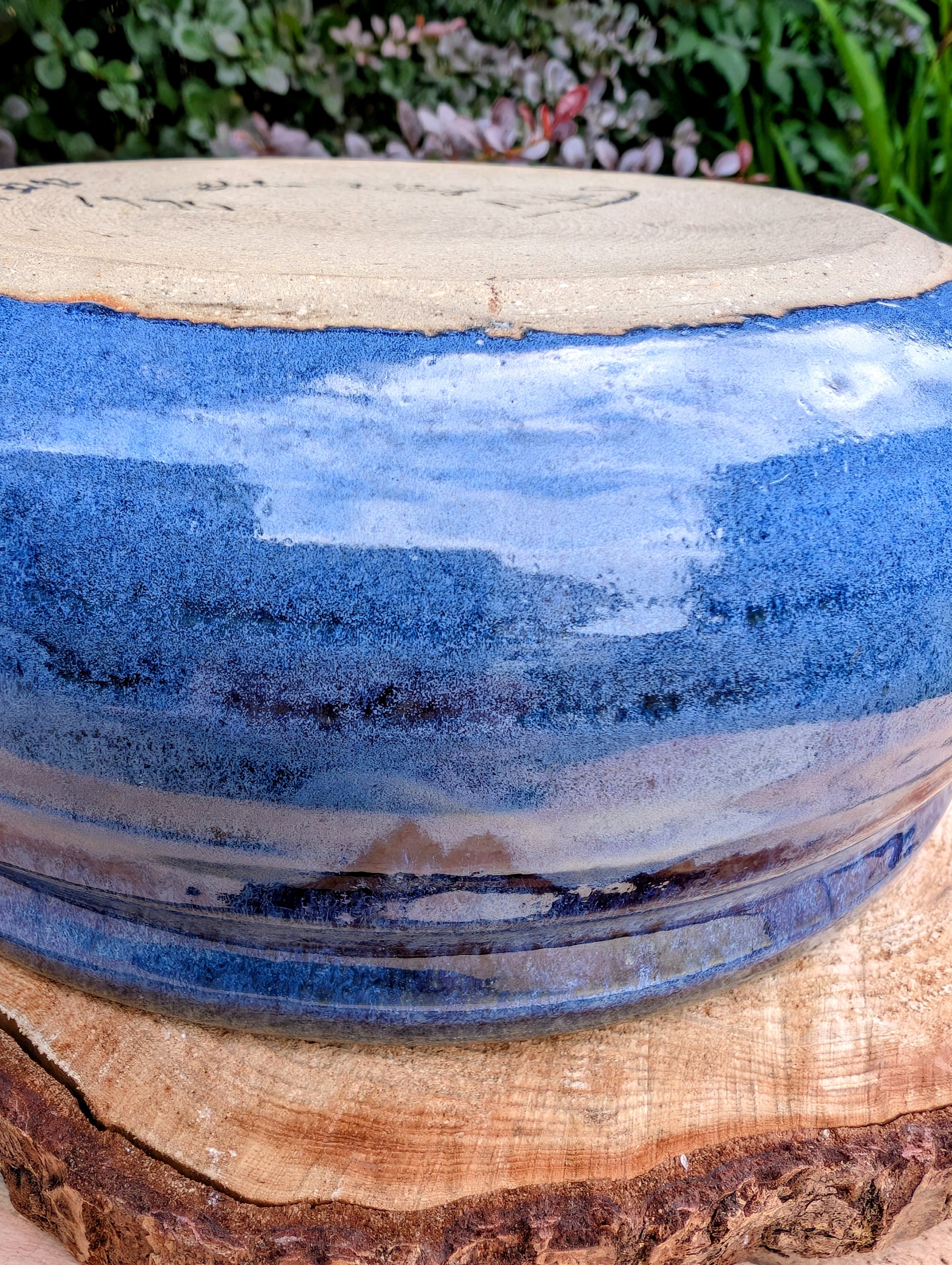 A beautifully hand-thrown studio pottery bowl dated 1990, featuring a rich satin cobalt blue glaze with a subtle spiral movement across the interior. Signed by the artist (maker currently unconfirmed), this functional stoneware piece blends everyday usefulness with timeless handcrafted artistry.