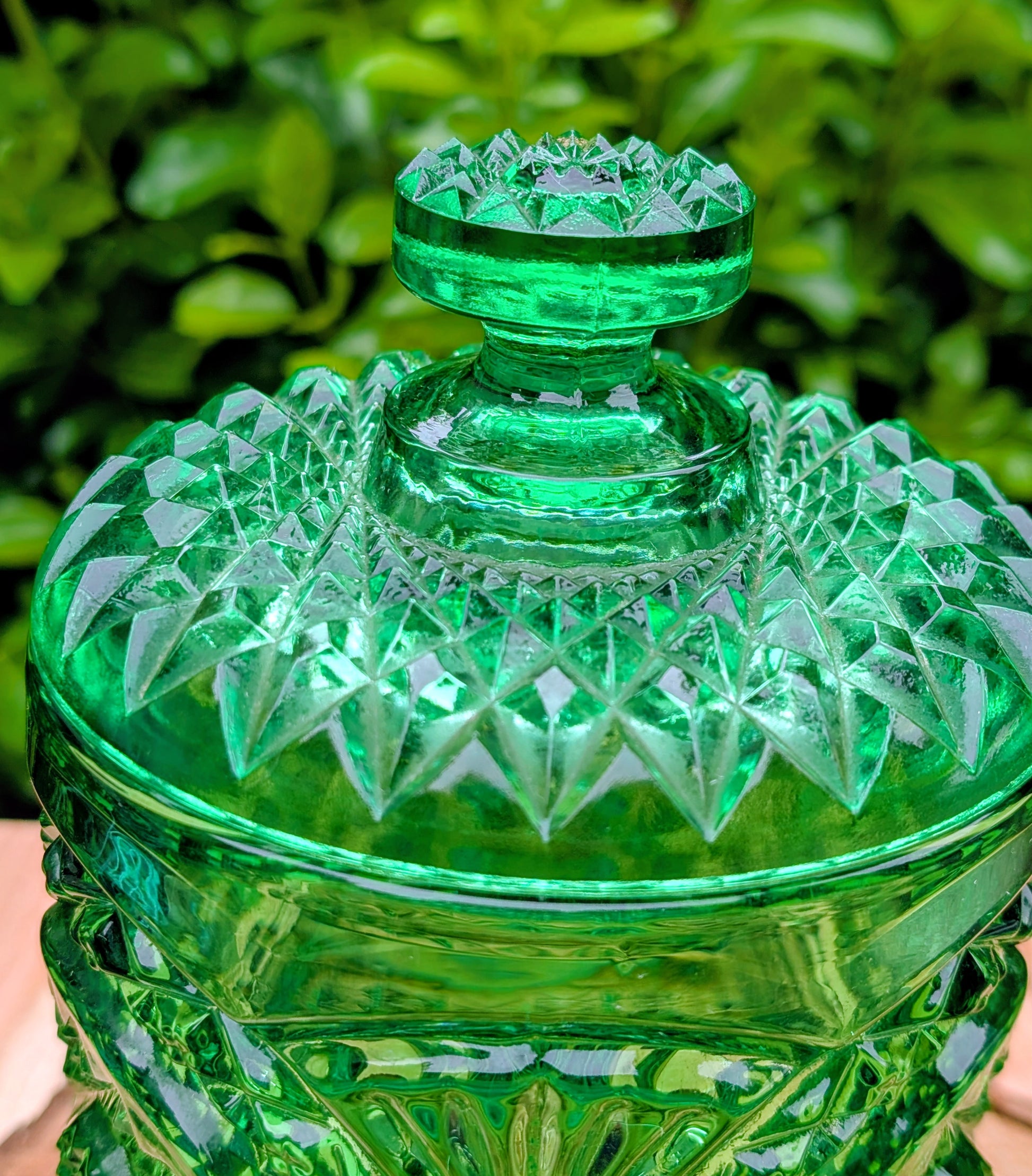 A brilliant Mid-Century collectible crafted in rich emerald pressed glass featuring Imperial's iconic Hobstar pattern.