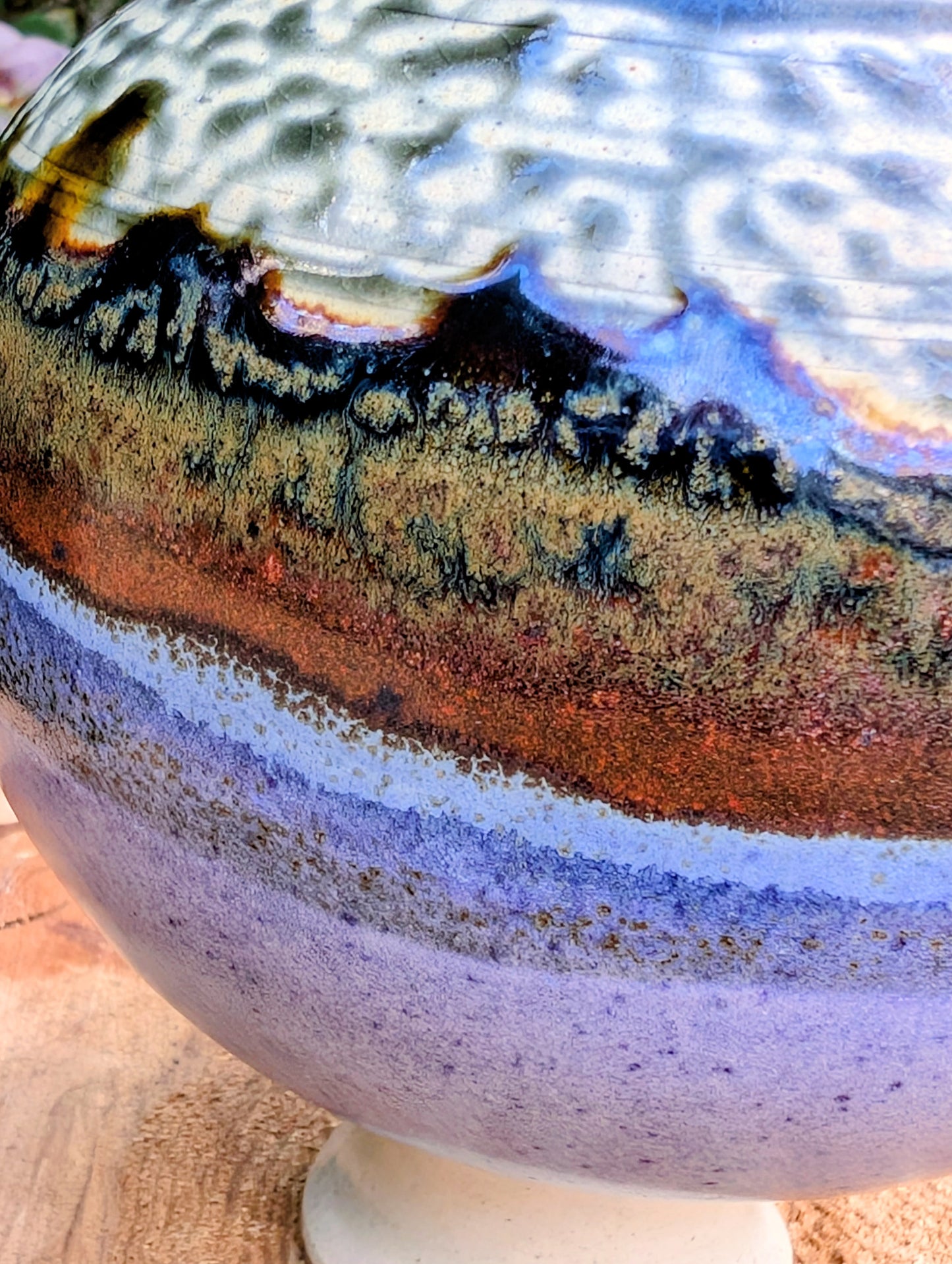 A beautifully signed studio pottery bud vase featuring a softly rounded bubble form and layered landscape-inspired glazes. Its organic silhouette and calming palette make it an elegant accent for modern, minimalist, and nature-inspired interiors.