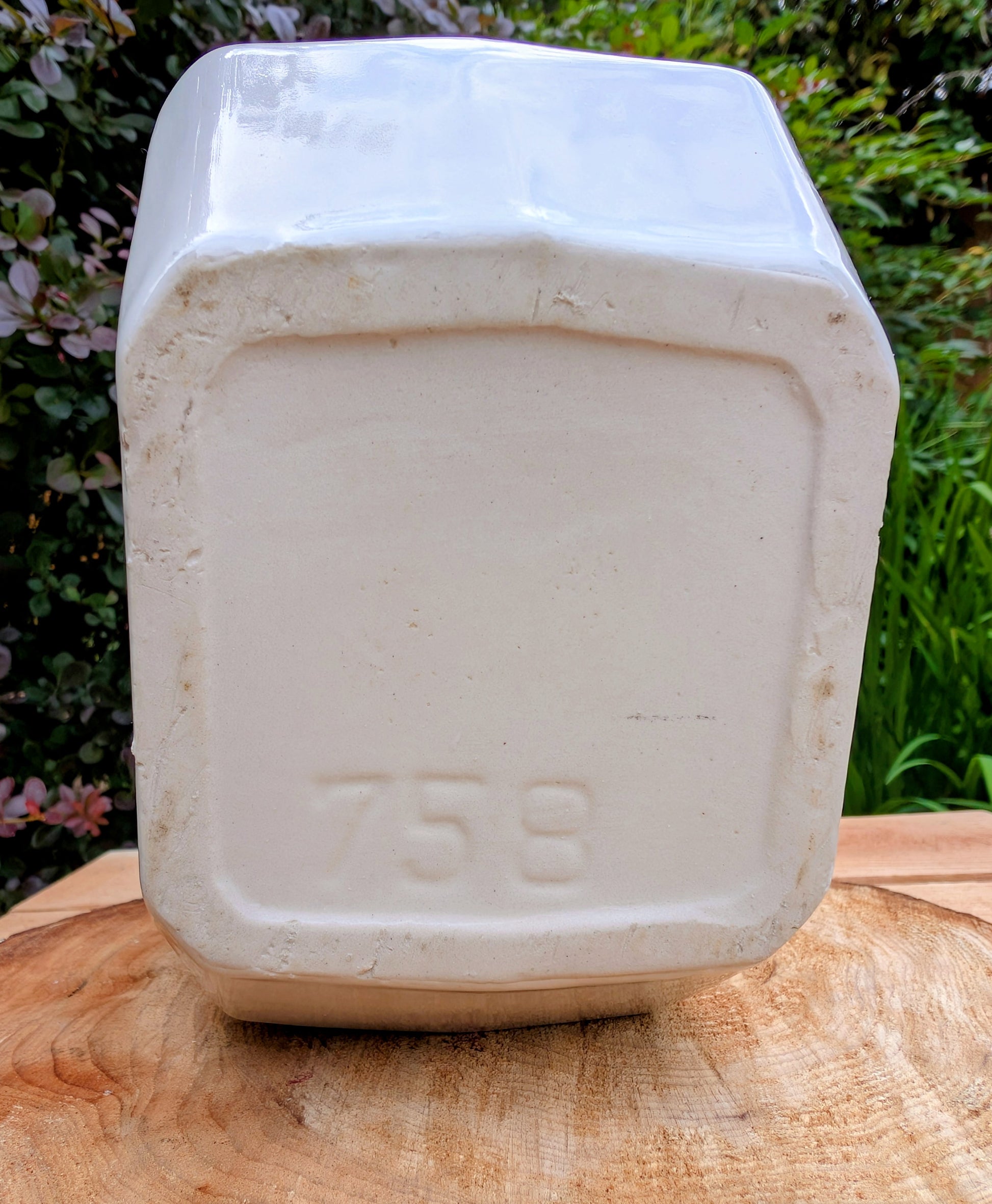 Bring timeless American Art Deco design into your home with this vintage Alamo Pottery Shape No. 758 pitcher. Its crisp geometric silhouette and glossy white glaze make it equally beautiful as a functional pitcher, sculptural vase, or decorative accent.