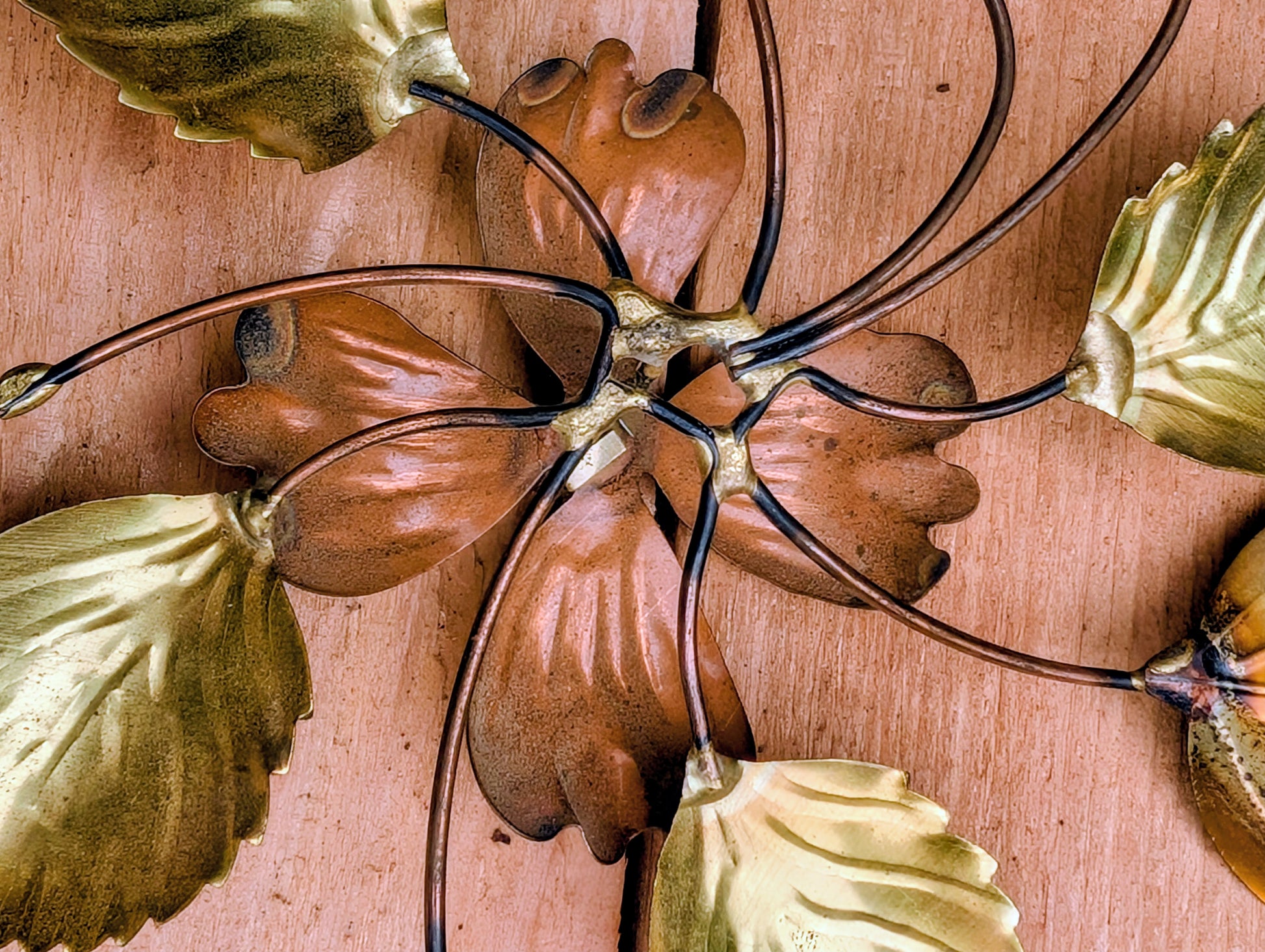 Bring the warmth of 1970s botanical décor into your home with this charming pair of vintage brass and copper-tone dogwood wall sculptures. Their delicate floral design and mixed-metal finish make them an easy addition to Mid-Century Modern, cottage, and nature-inspired interiors.