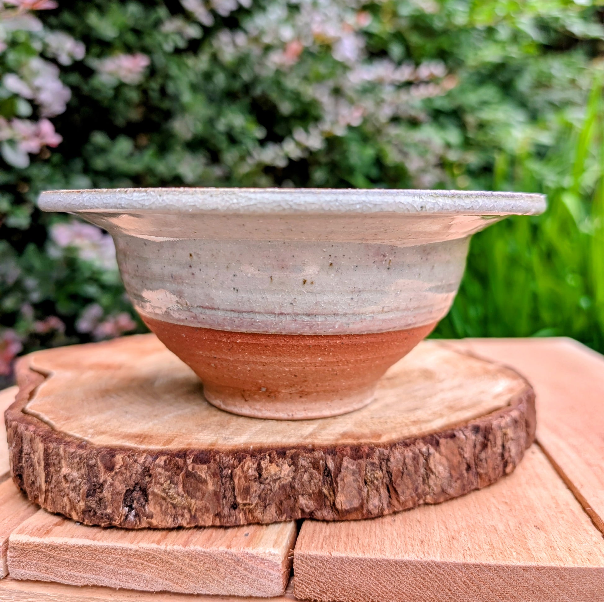Handcrafted with timeless simplicity, this signed studio pottery serving bowl pairs a soft celadon-gray glaze with a warm iron-rich stoneware body. Its versatile size and understated design make it equally beautiful for serving, display, or everyday living.