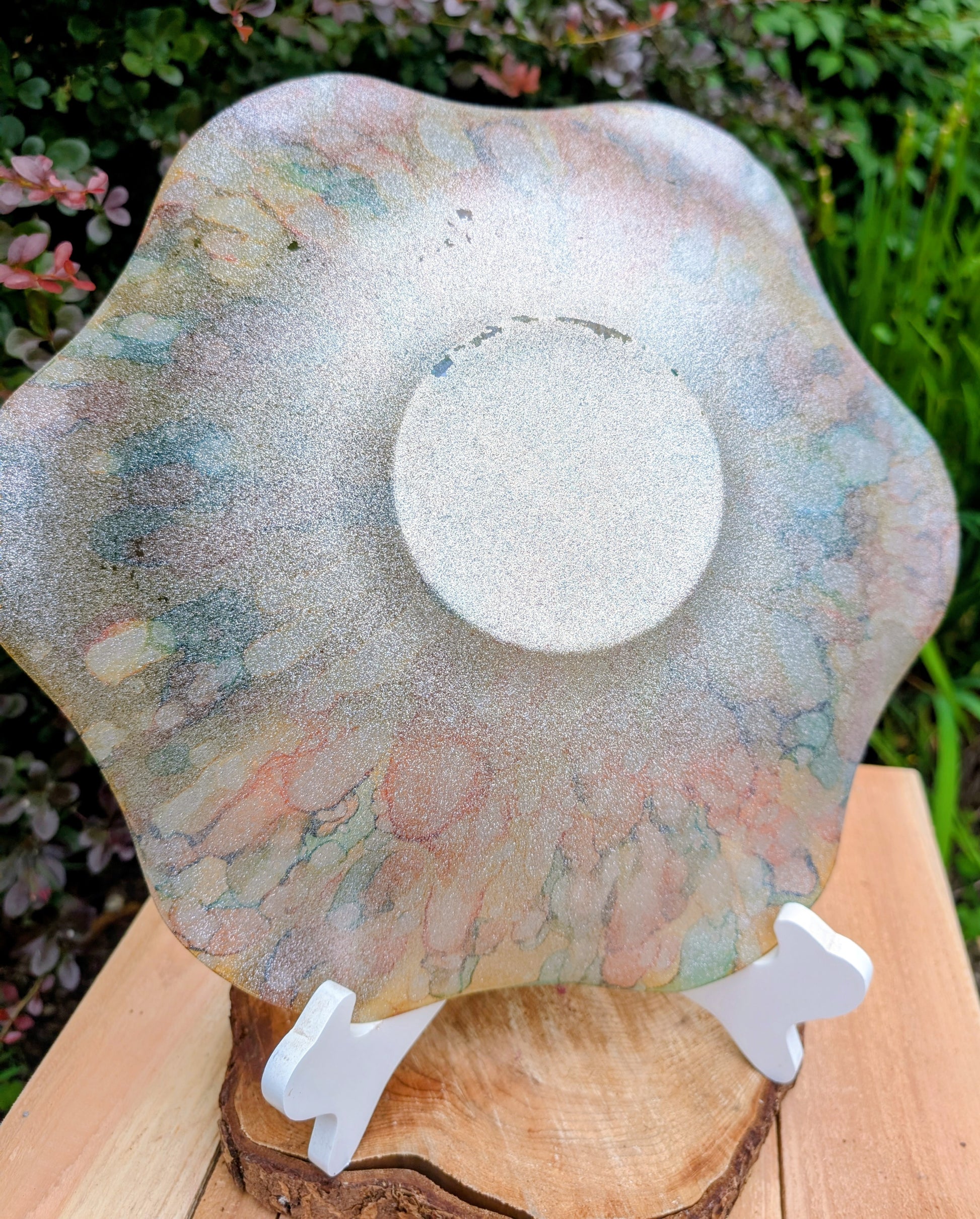 Bring color and light to your home or garden with this contemporary scalloped art glass bowl. Featuring warm golden tones accented by olive green, amber, turquoise, and shimmering metallic highlights, it serves beautifully as a centerpiece, decorative bowl, or tabletop bird bath.