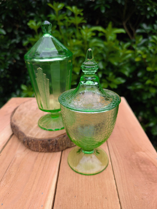Two beautiful vintage emerald green covered pedestal candy dishes are offered in one convenient listing. Choose between a textured crackle glass design or an elegant Art Deco geometric pattern—each sold individually and carefully curated for collectors and vintage home décor enthusiasts.