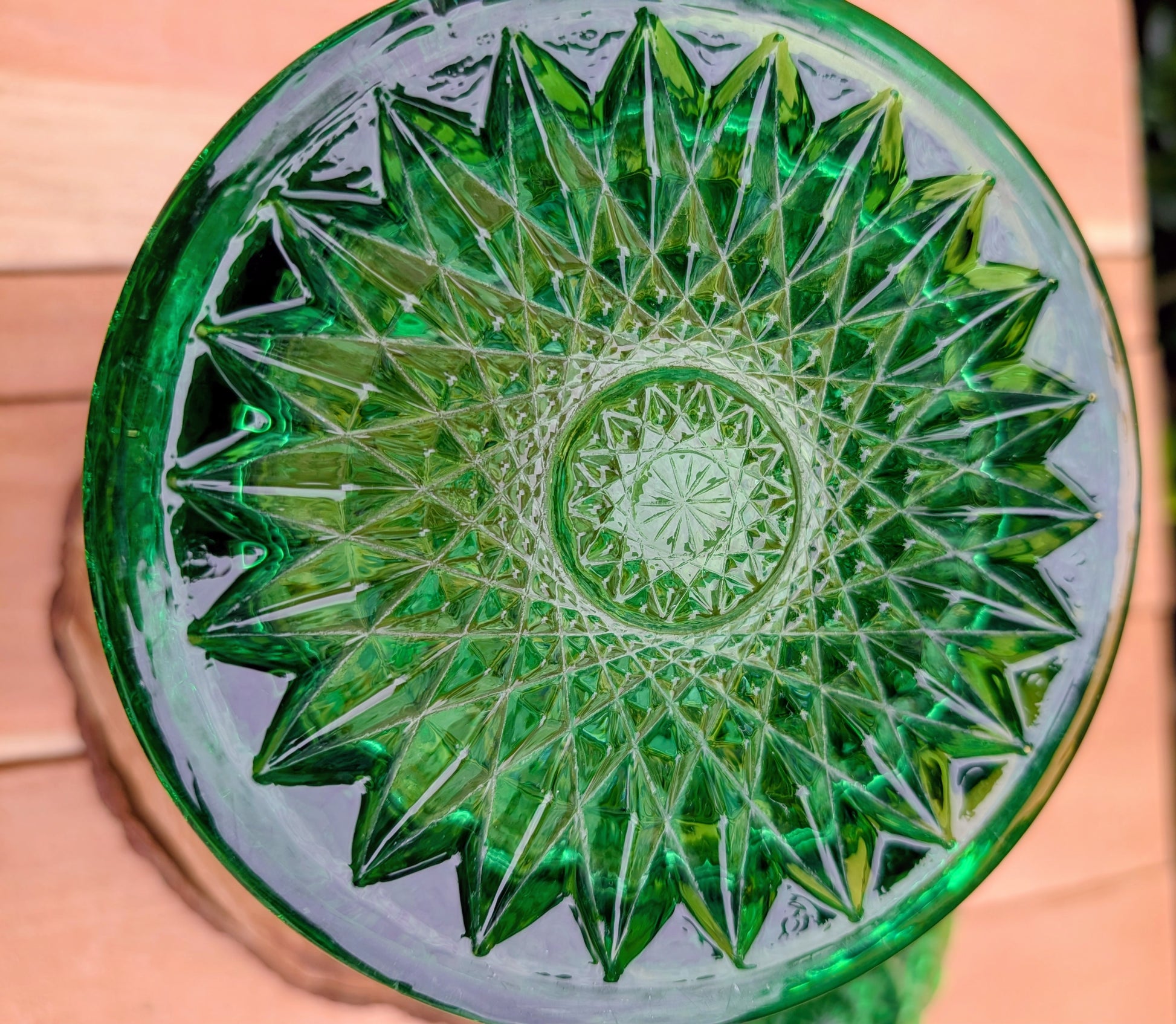 A brilliant Mid-Century collectible crafted in rich emerald pressed glass featuring Imperial's iconic Hobstar pattern.
