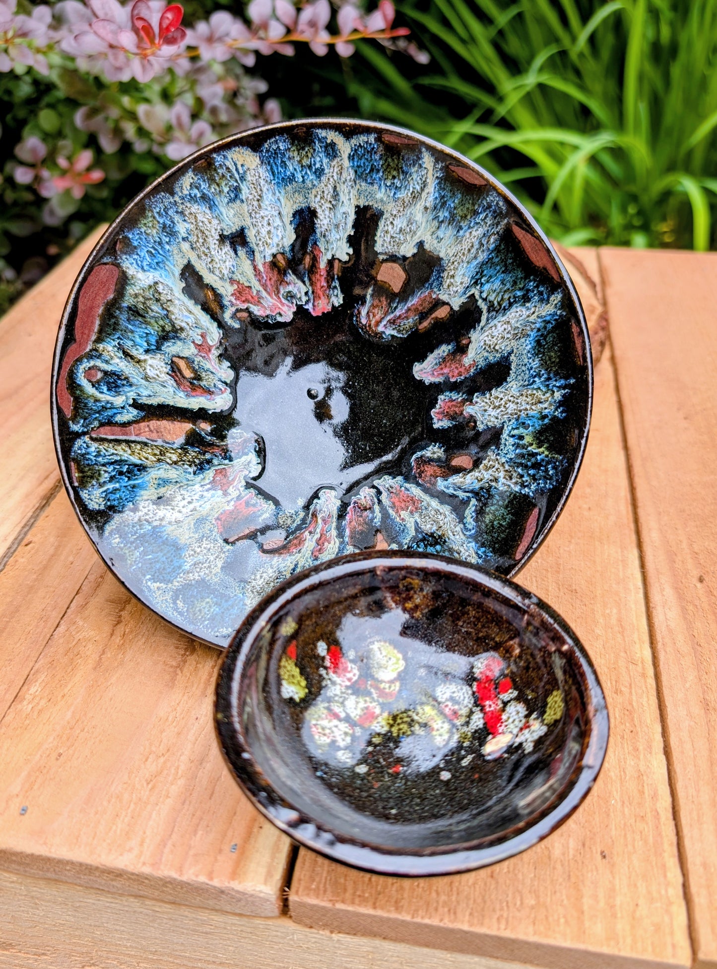 This coordinating set of two handmade studio pottery bowls showcases beautiful reactive glazes and timeless artisan craftsmanship. Perfect for serving, displaying, or gifting, the complementary designs bring warmth and organic character to any home.