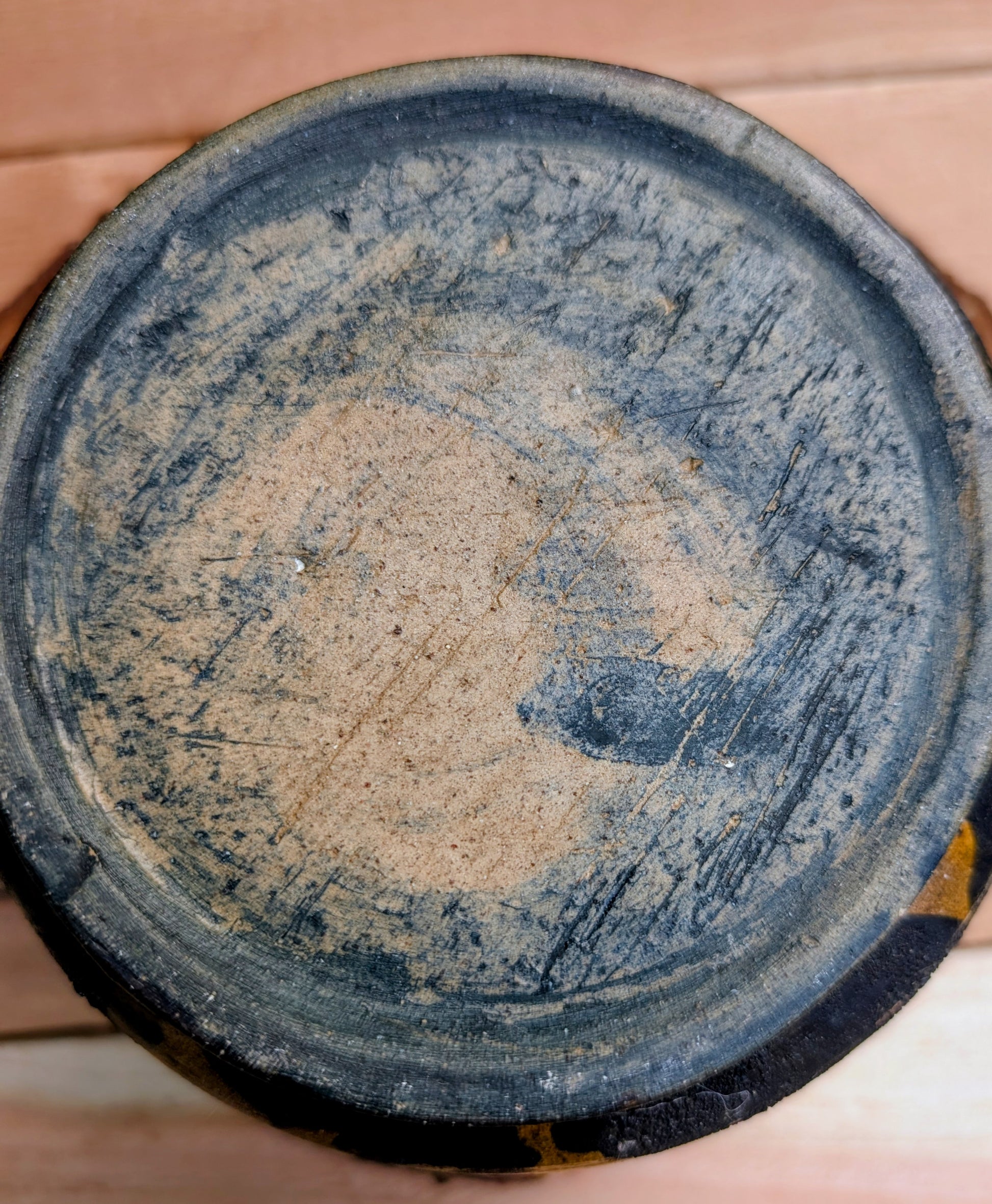 A beautifully hand-thrown studio pottery bowl featuring a rich cobalt blue interior, earthy ochre exterior, and expressive black drip glaze. Its timeless craftsmanship and organic design make it equally suited for serving, display, or adding artisan character to any Pacific Northwest-inspired home.