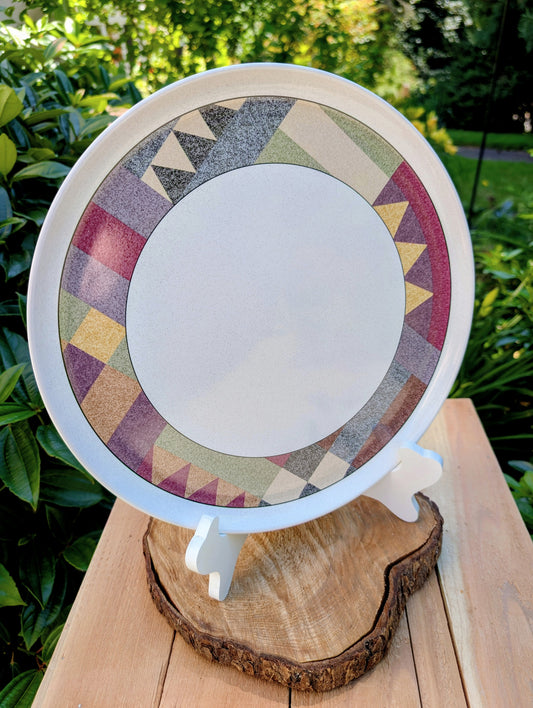 Bring warm desert-inspired style to your table or home with this vintage Studio Nova Palm Desert serving platter, designed by Nancy Green in 1995. Its earthy geometric border and durable stoneware construction make it equally beautiful for entertaining, seasonal displays, or everyday décor.