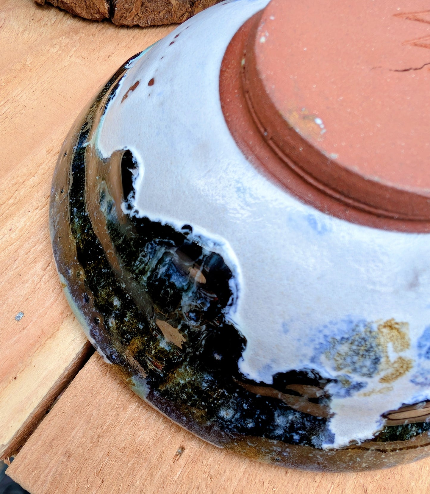 Bring handcrafted artistry to your table with this matching pair of signed studio pottery bowls. Finished with richly layered reactive glazes in cobalt blue, teal, amber, and ivory, these versatile artisan bowls are equally beautiful for entertaining or everyday display.