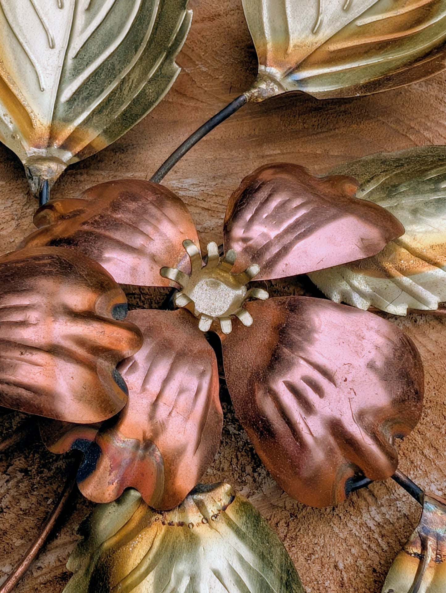 Bring the warmth of 1970s botanical décor into your home with this charming pair of vintage brass and copper-tone dogwood wall sculptures. Their delicate floral design and mixed-metal finish make them an easy addition to Mid-Century Modern, cottage, and nature-inspired interiors.